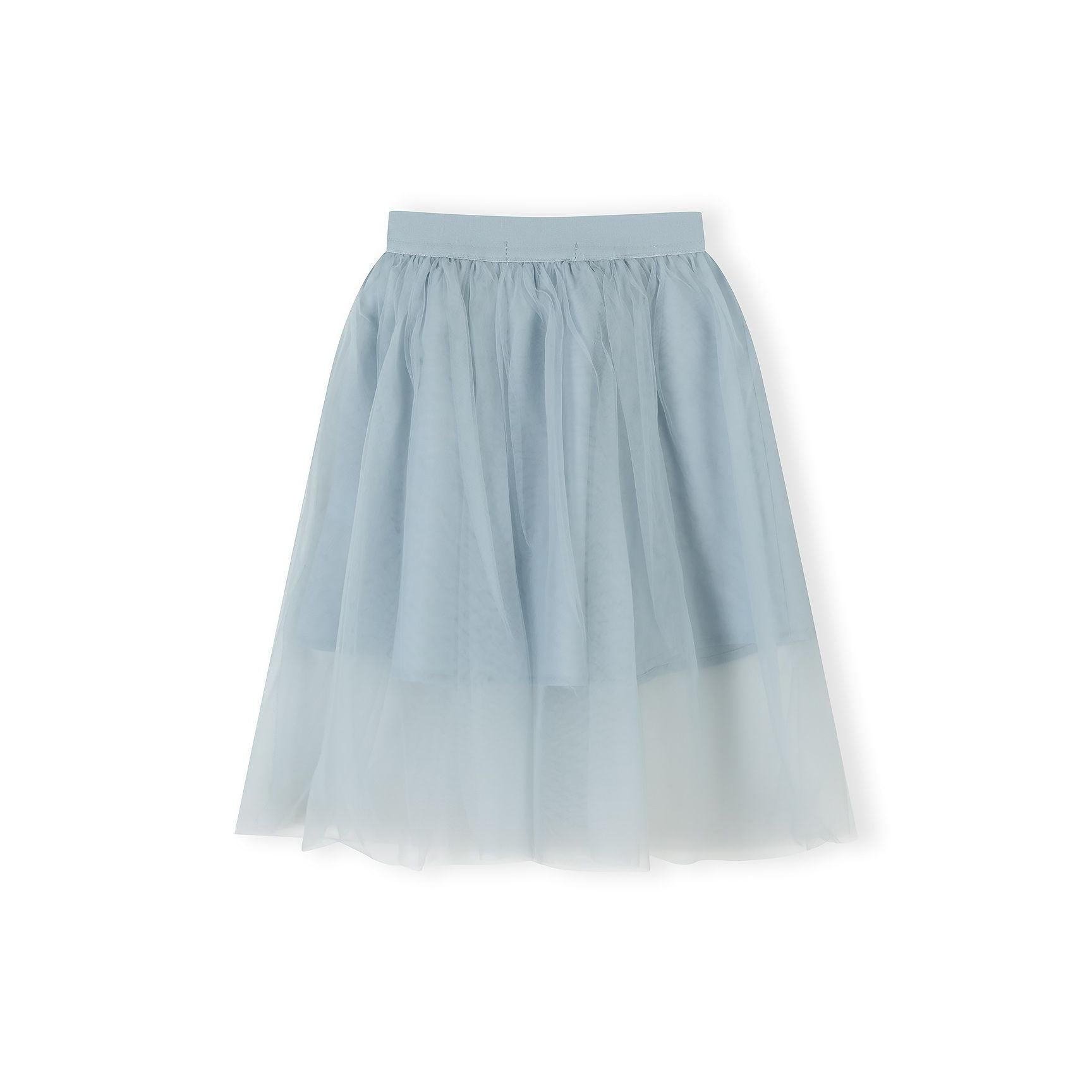 Detail shot of grey tulle fabric showing the delicate pleated texture and waistband construction of the maxi skirt