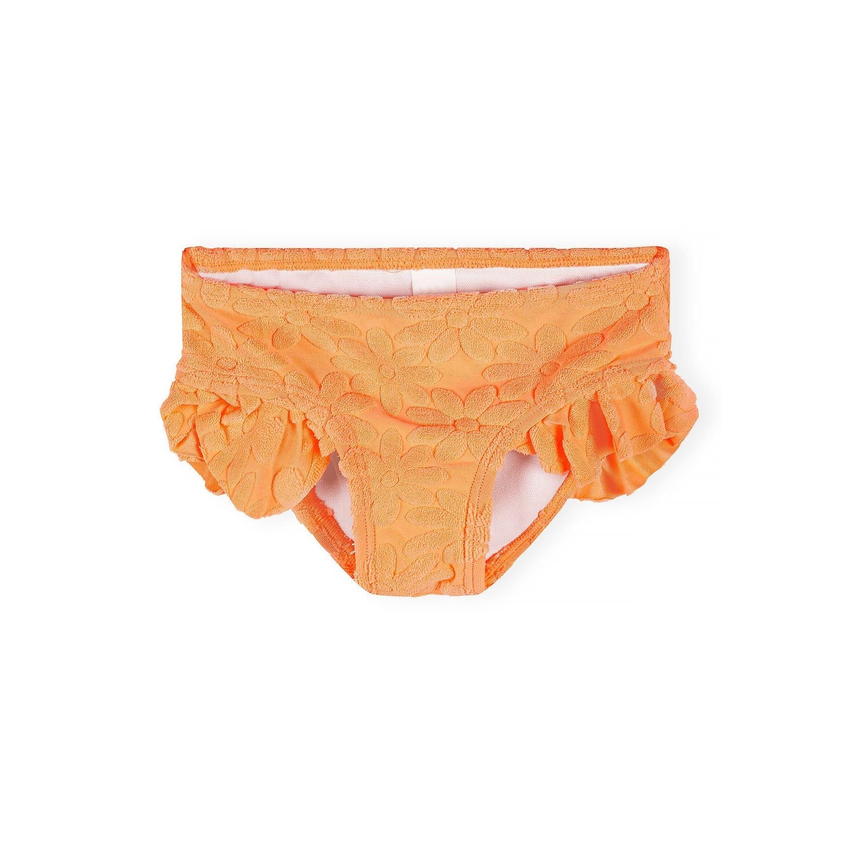 Detail shot showing textured floral jacquard pattern and frill trim construction on neon orange bikini fabric