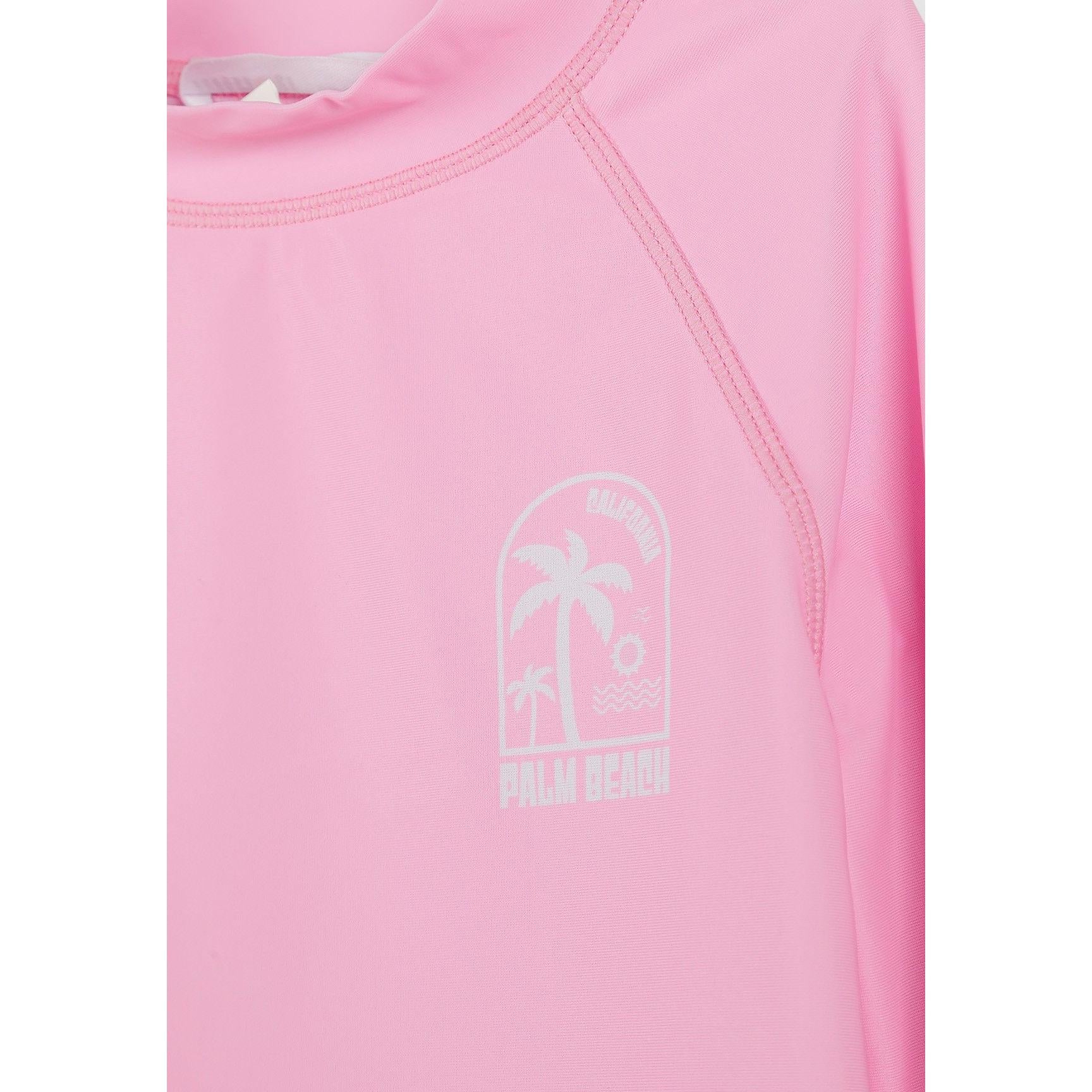 Close-up detail of pastel tie-dye fabric texture showing pink, purple and mint color blend in swim t-shirt material