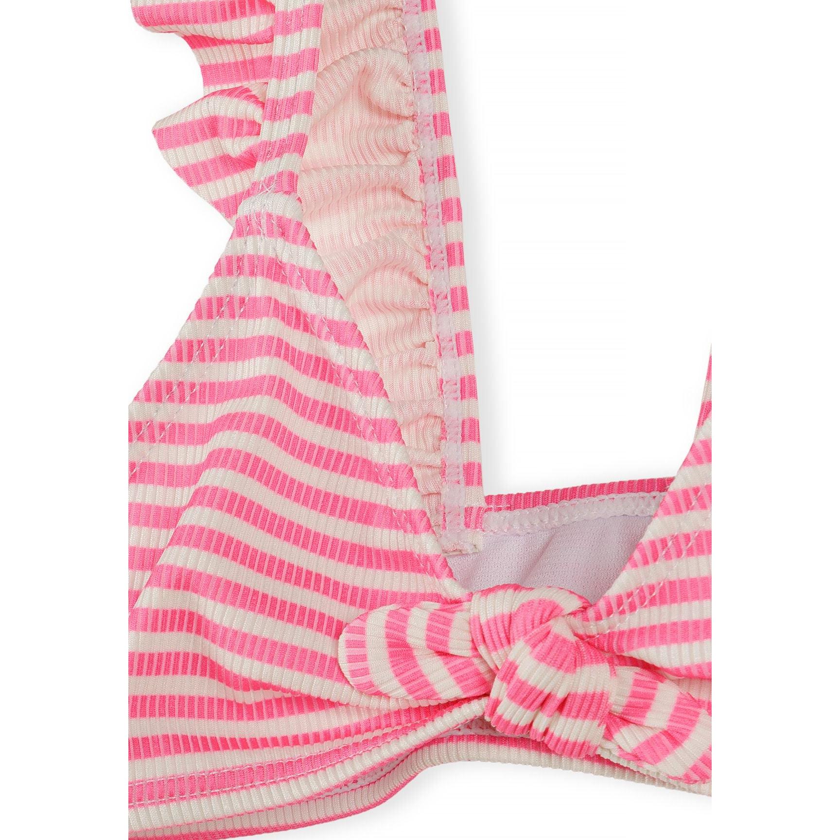 Close-up detail of pink and white striped bikini top showing frill trim along straps and front tie detail with textured fabric pattern