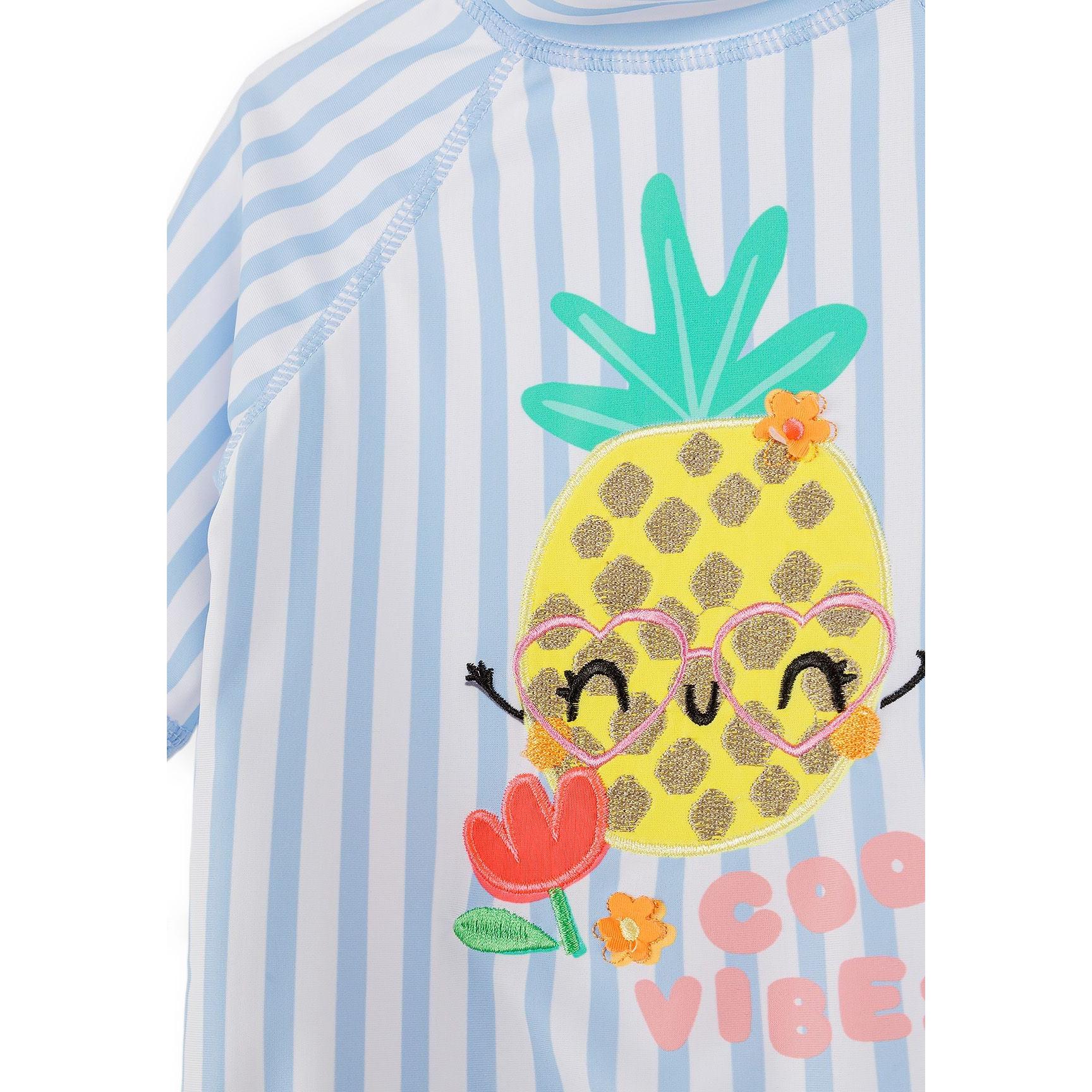 Blue and white striped rash vest set with pineapple character wearing heart-shaped sunglasses, showing UPF 50+ care label and Minoti branding tag