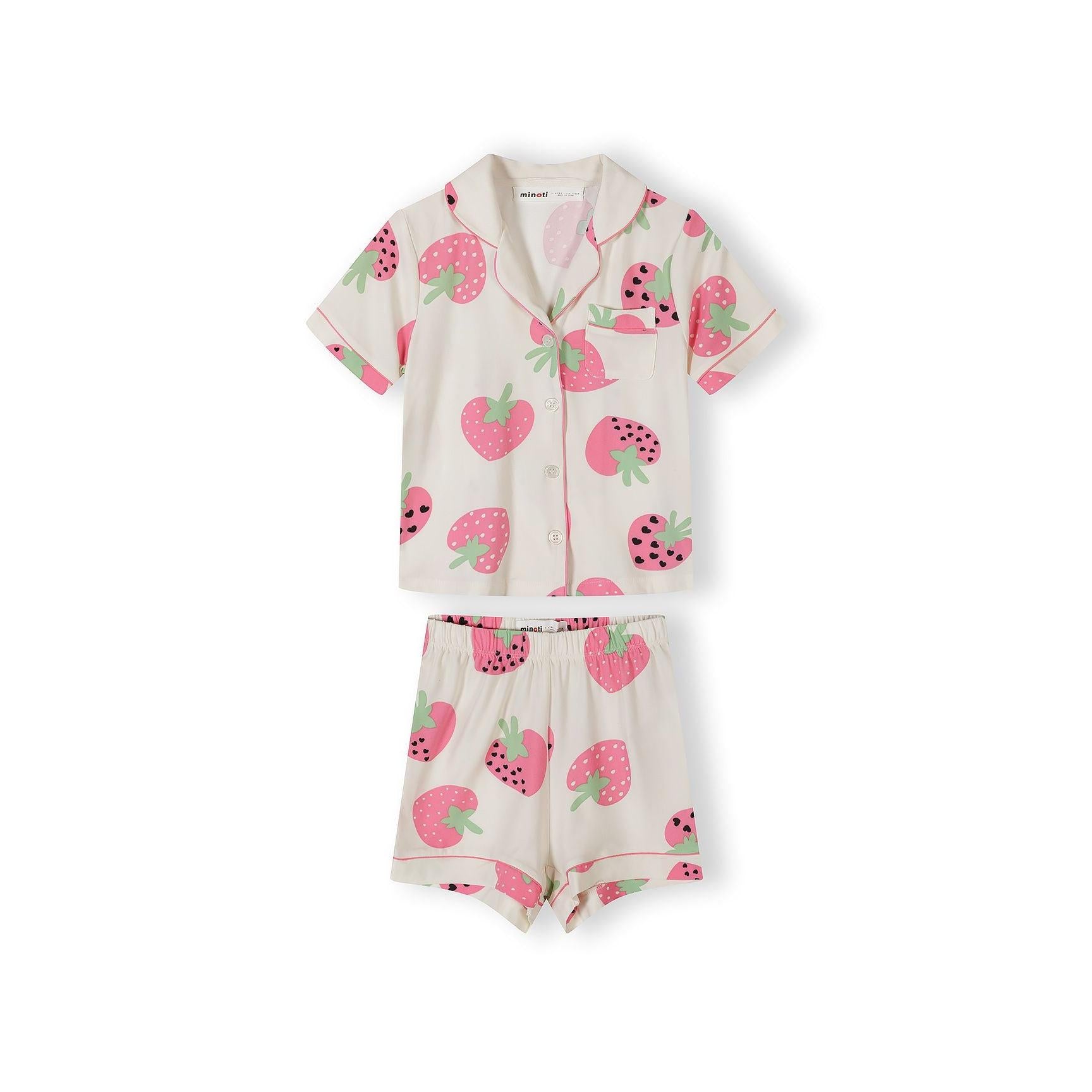 Close-up detail of cream pyjama top showing strawberry print pattern, pink collar trim, chest pocket and button closure with Minoti label visible