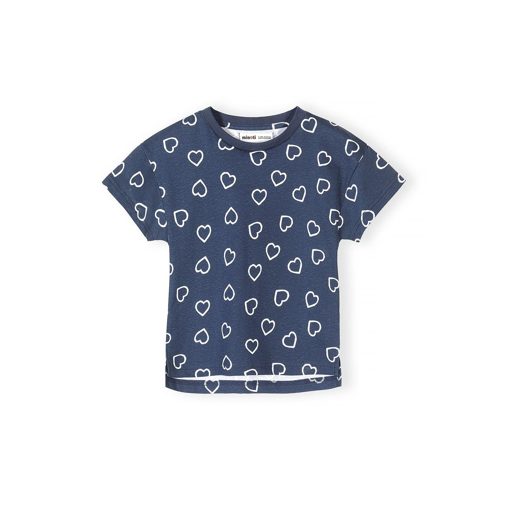Detail shot of coral red t-shirt featuring white heart outline pattern scattered across the fabric with Minoti label at neckline