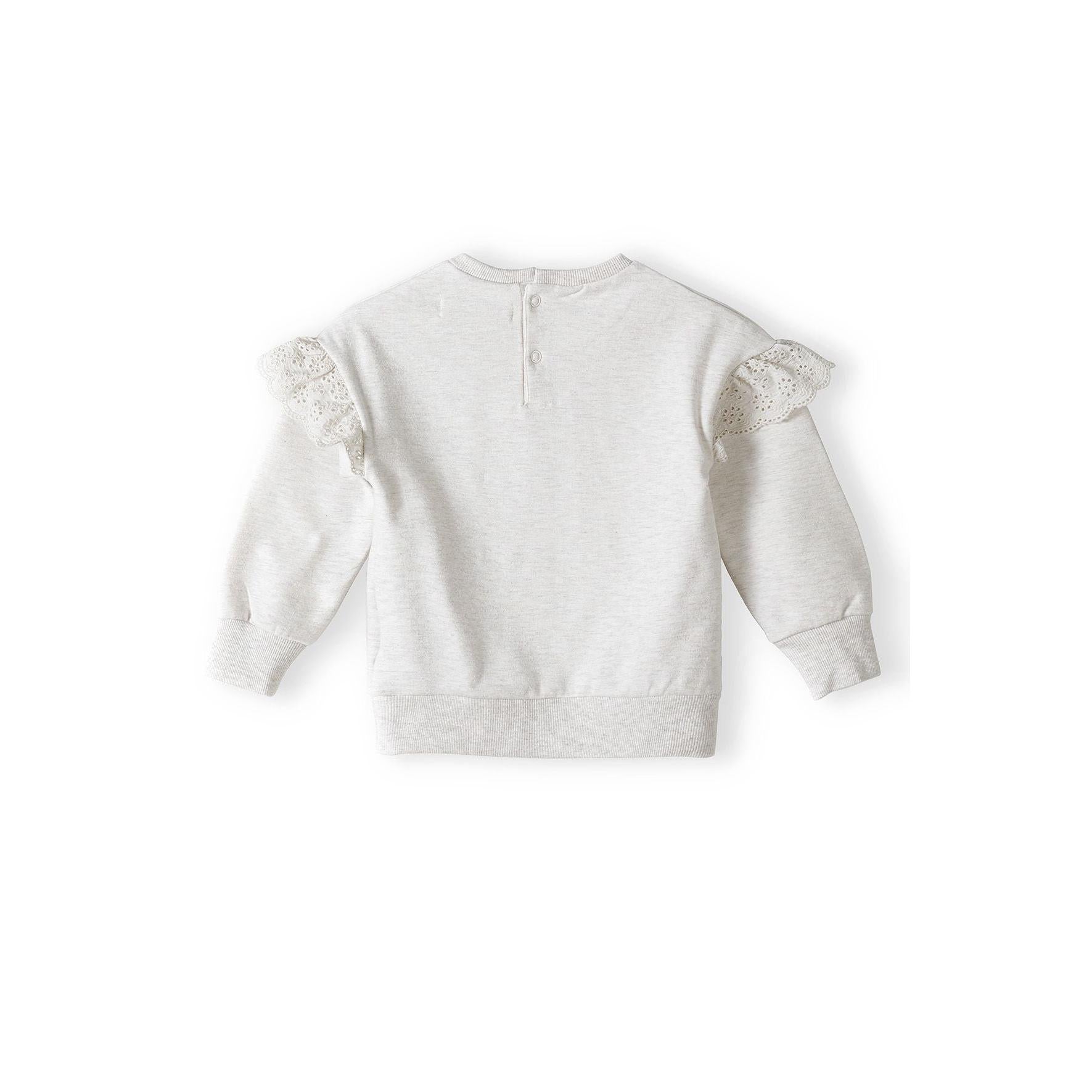 Back view of beige fleece sweatshirt showing button closure at neck and delicate lace frill details on sleeves against white background