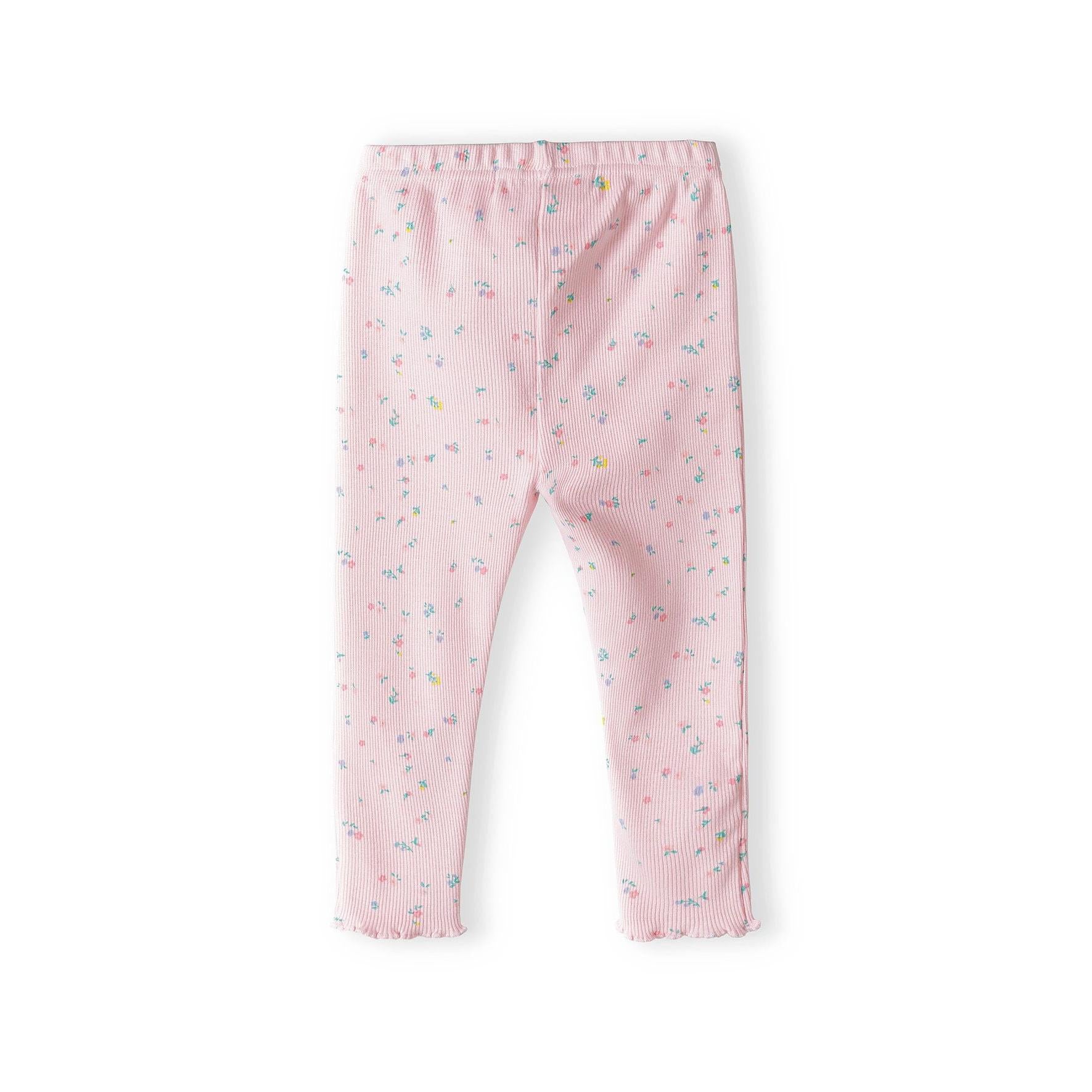 Pink ribbed leggings with scattered small multicoloured print pattern shown flat against white background