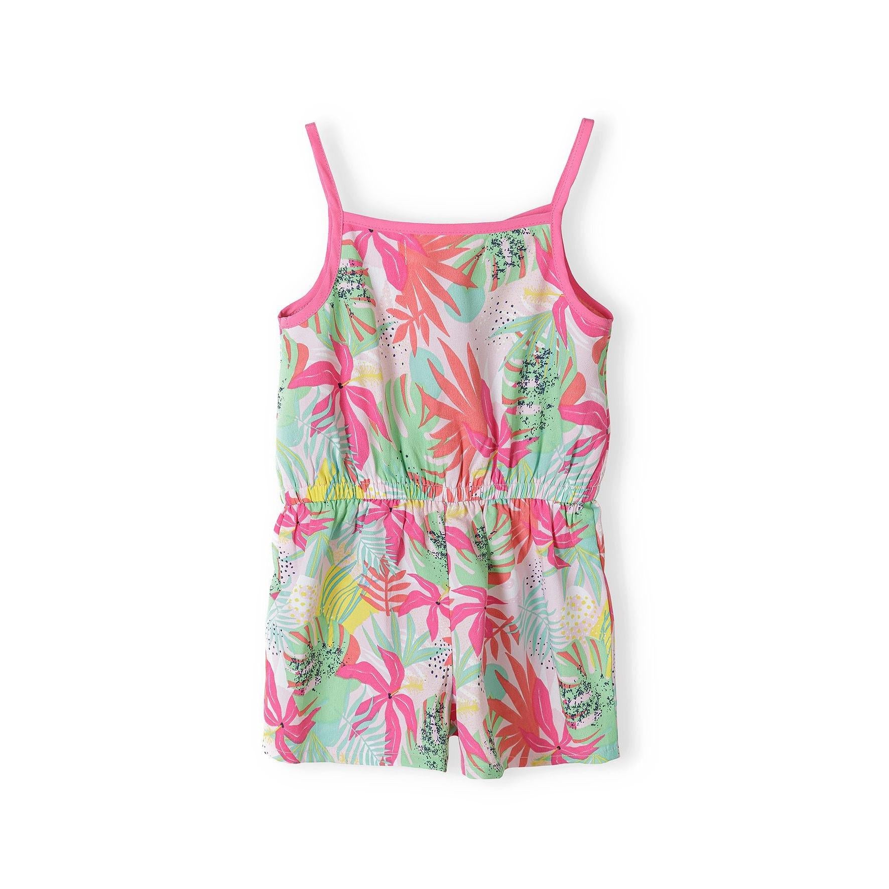 Flat lay of tropical print playsuit showing button-front closure, adjustable straps and vibrant botanical pattern in pink, green and coral tones