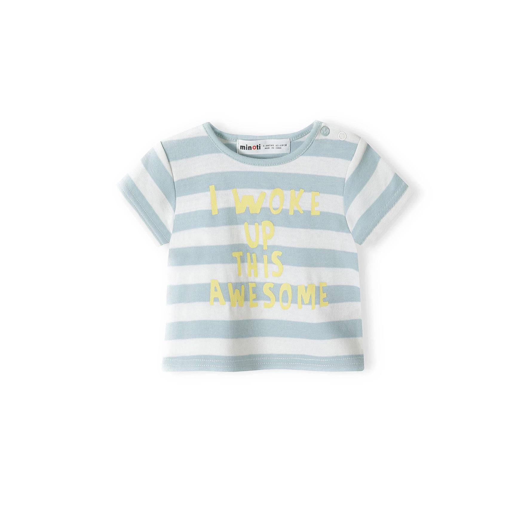 Close-up front view of striped baby t-shirt in blue and white with yellow text 'I Woke Up This Awesome' against white background, showing Minoti label at neck