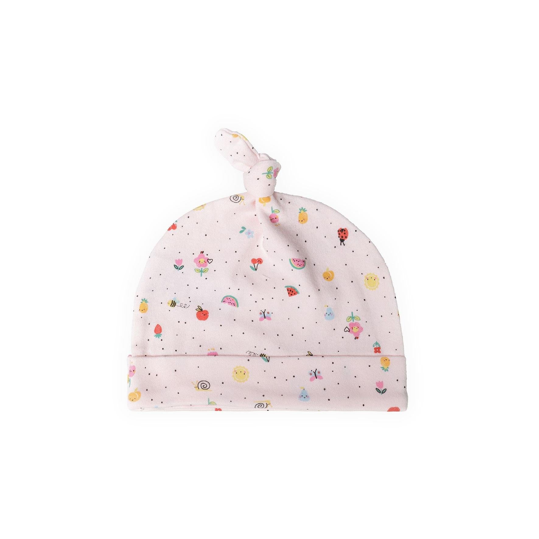 Pink baby hat with small scattered fruit and animal print pattern, featuring knotted top and turned-up brim detail against white background