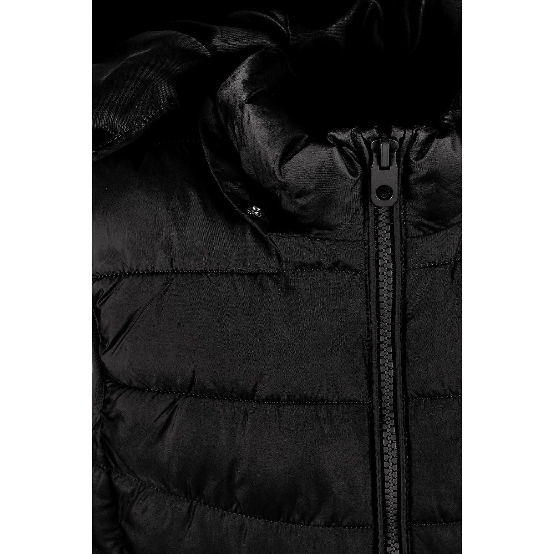 Detail view of black padded gilet front zipper and quilted chest panel construction