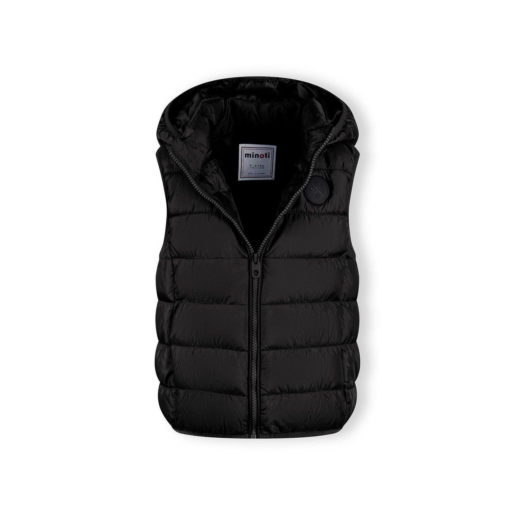 Detail view of black padded gilet front zipper and quilted chest panel construction