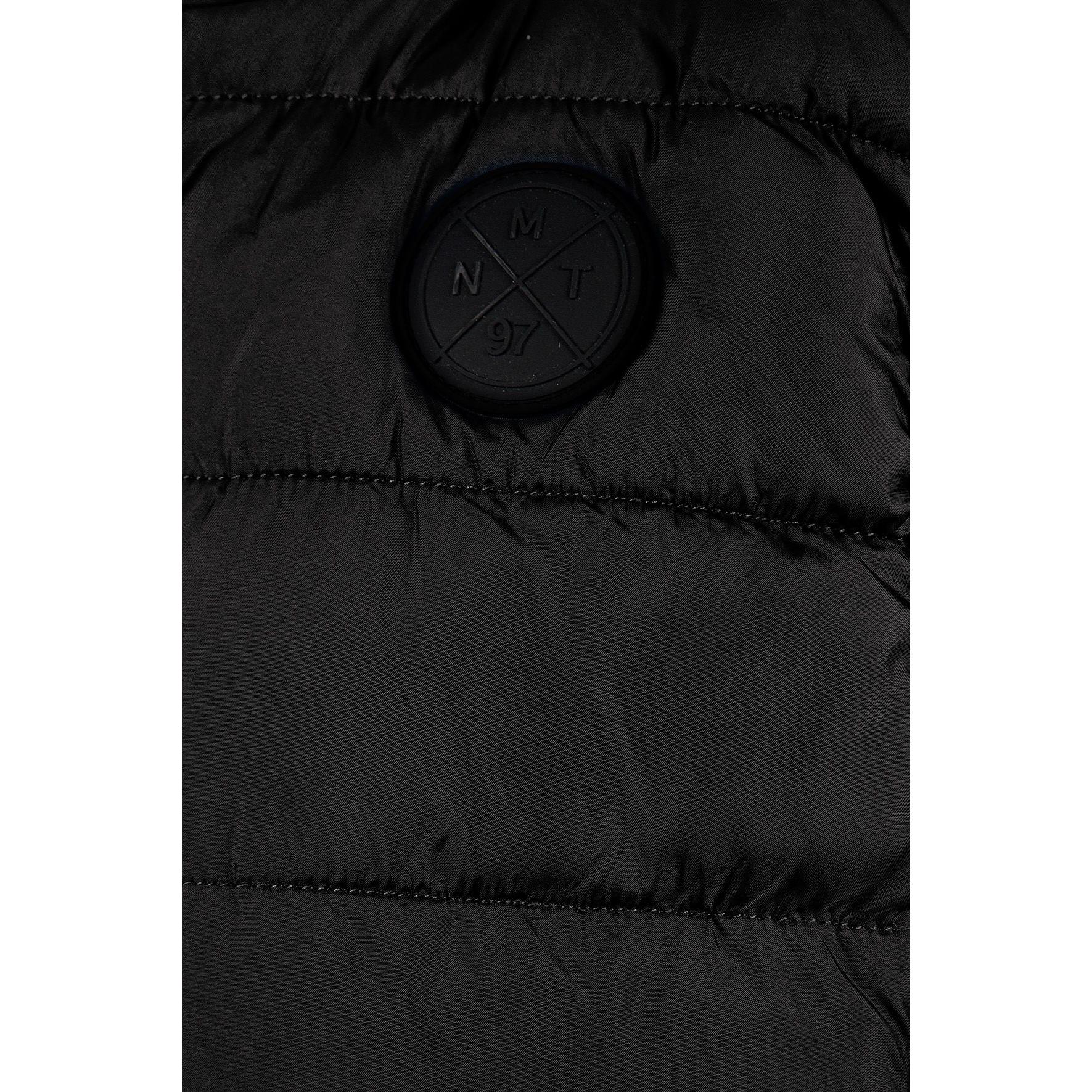 Detail view of black padded gilet front zipper and quilted chest panel construction