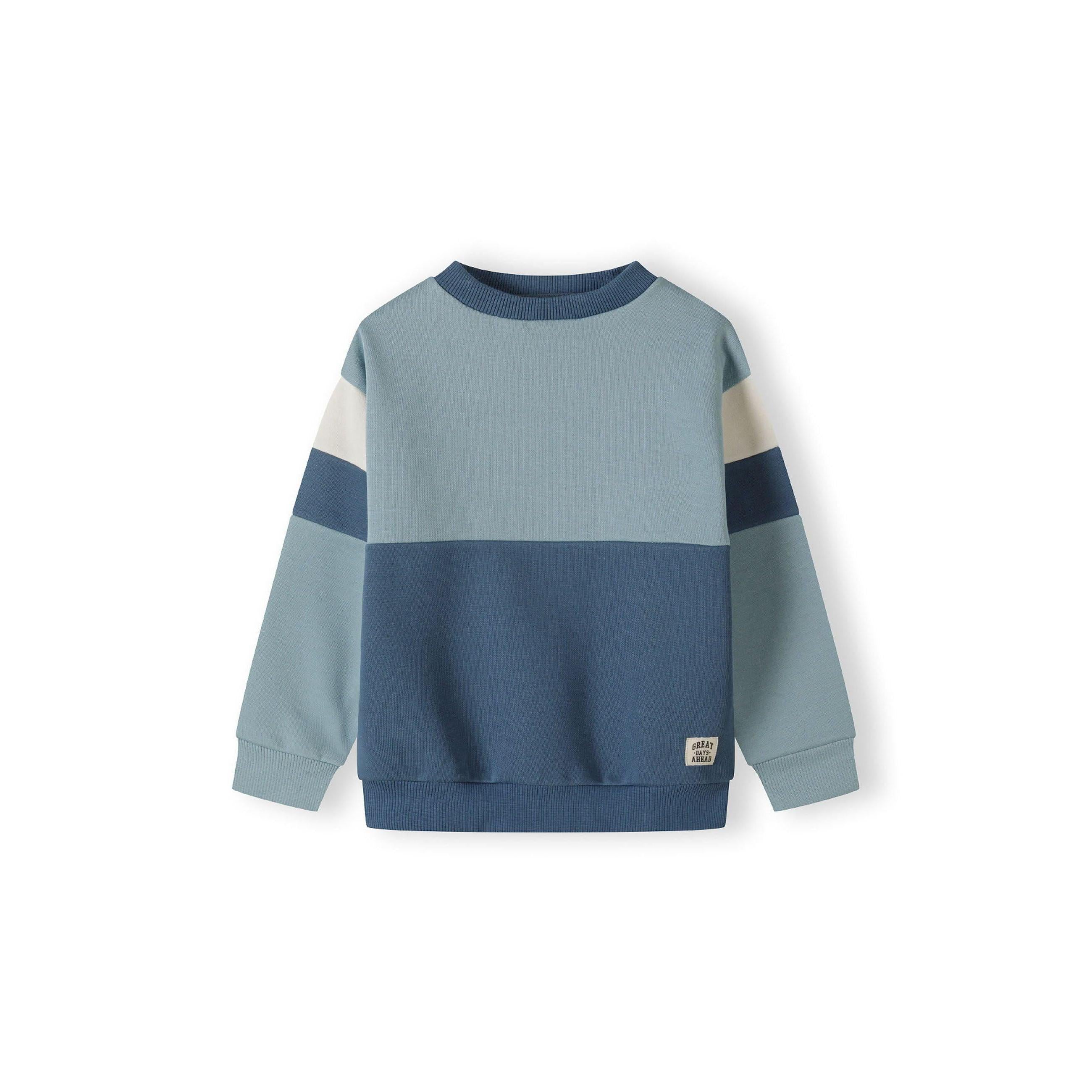 Close-up detail of blue joggers showing drawstring waistband and soft fabric texture