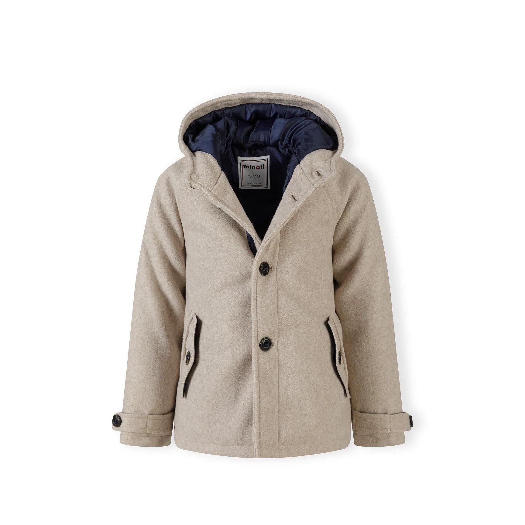 Close-up detail of coat sleeve showing buttoned cuff tab with dark button on beige wool-blend fabric