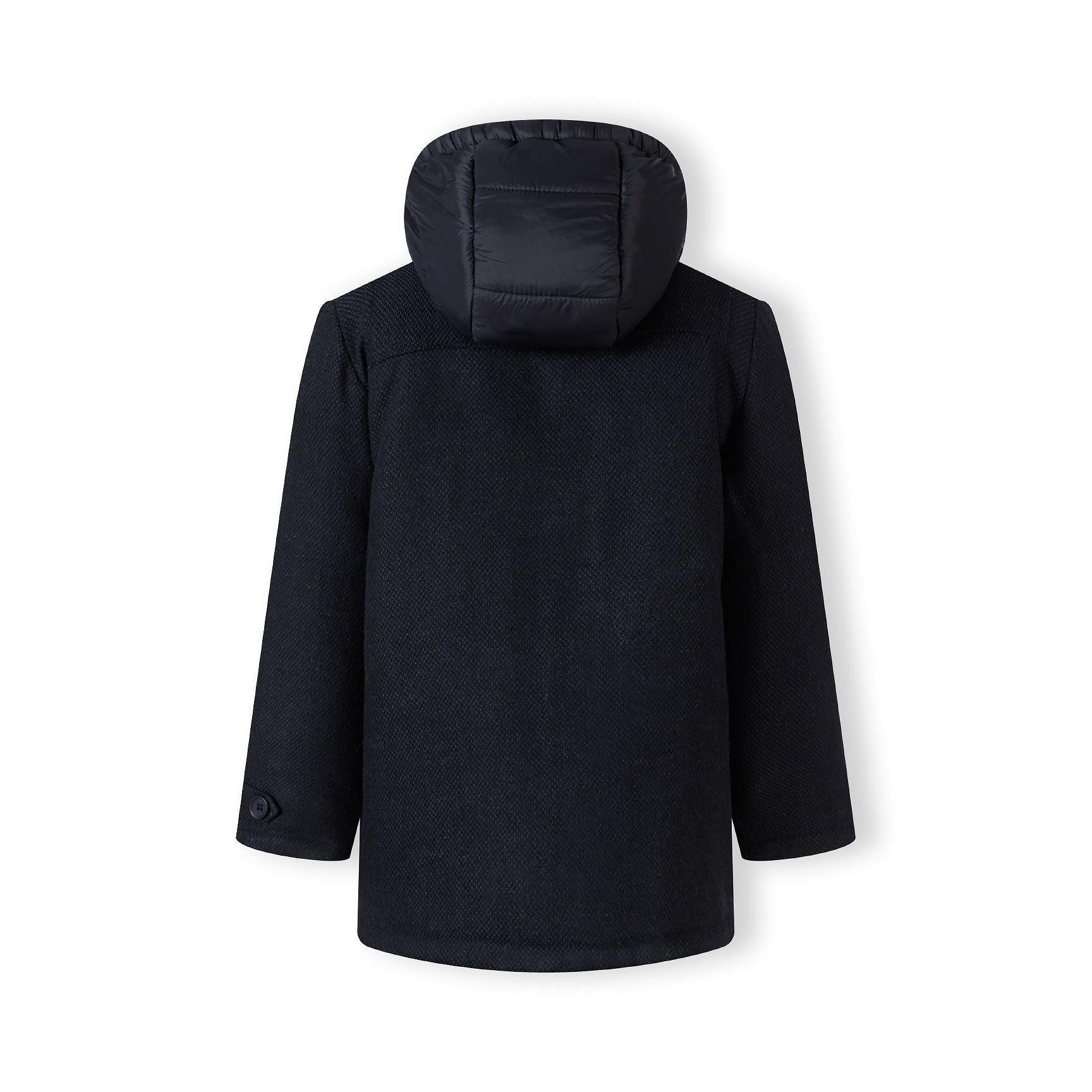 Navy duffle coat laid flat showing back view with textured wool fabric and nylon hood on white background