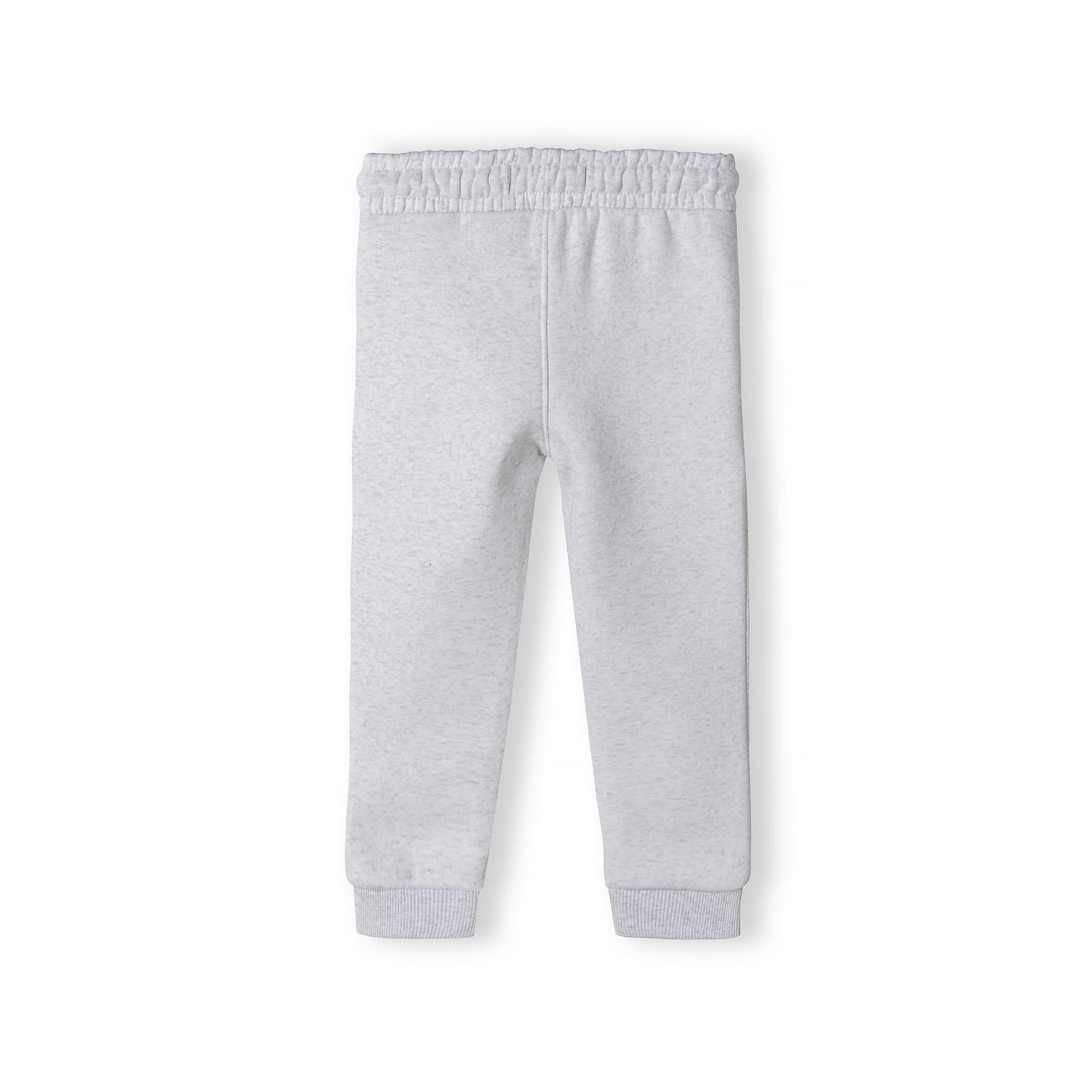 Grey joggers laid flat showing full length view with elasticated waistband and ribbed cuffs