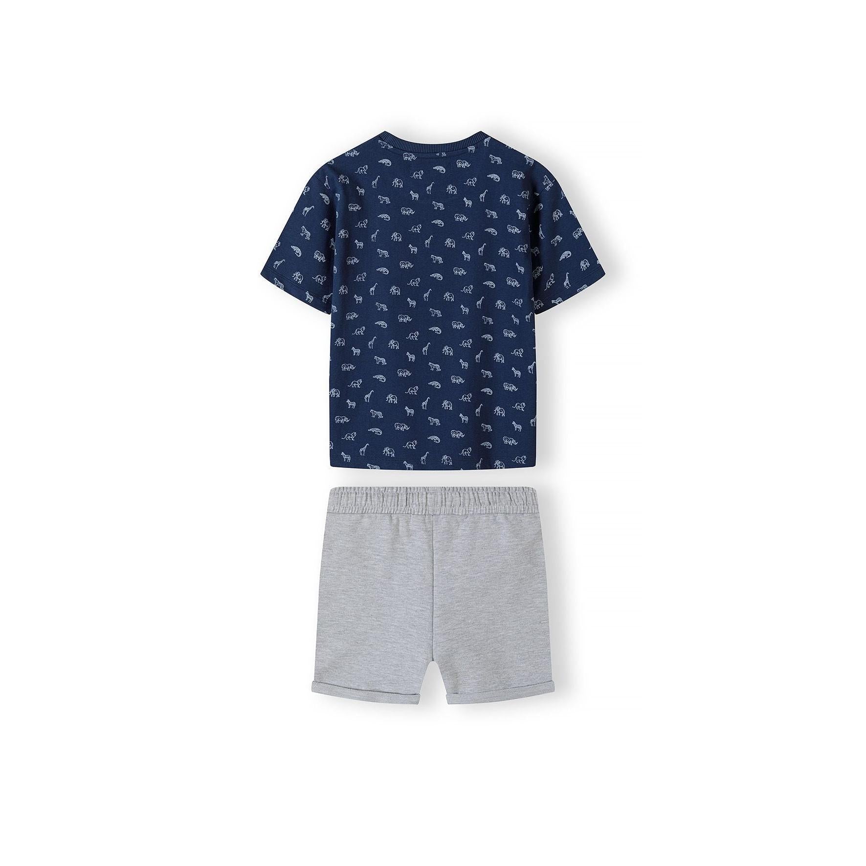 Close-up detail of navy t-shirt showing Wild Thing text in bright green with crocodile illustration and small white safari animals pattern