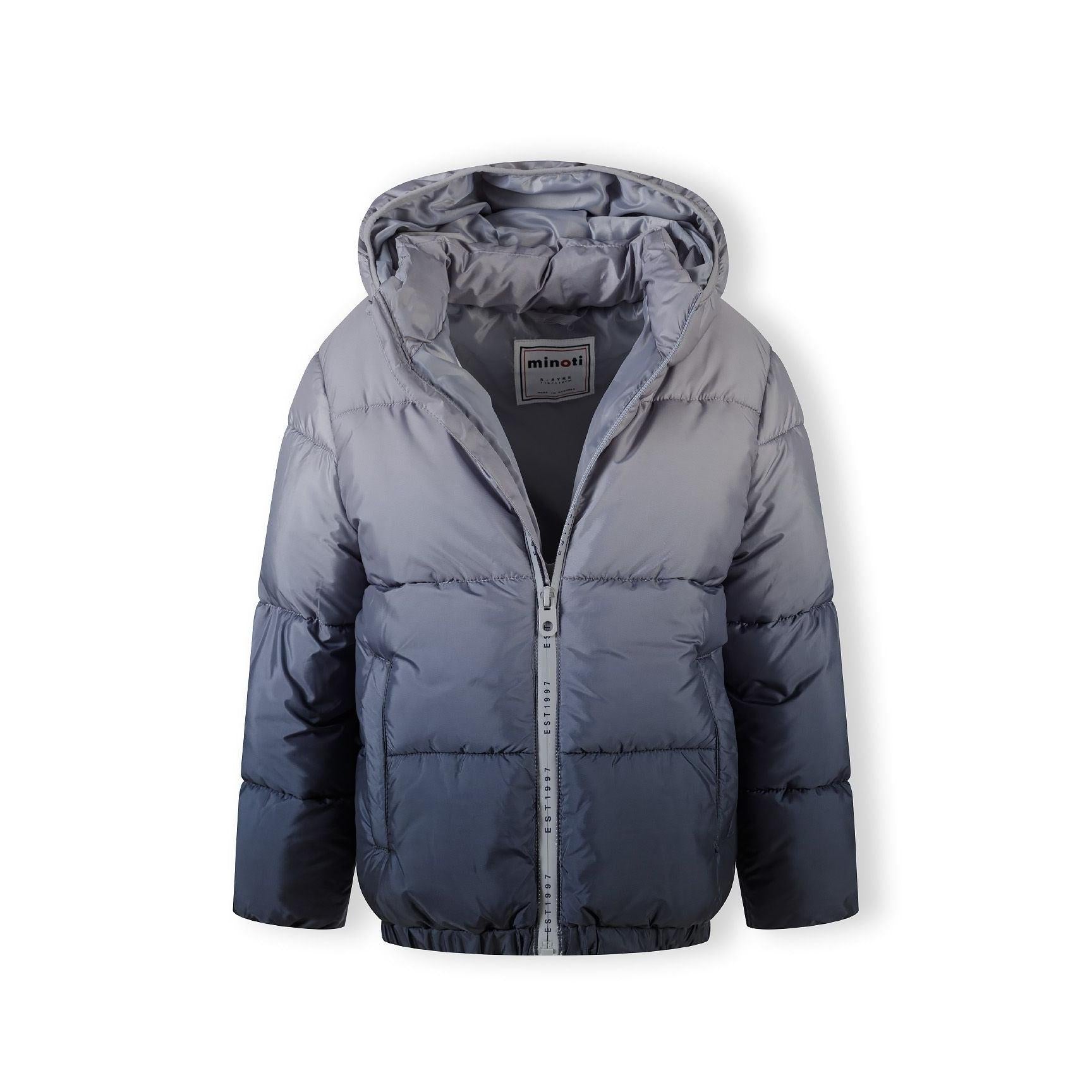Grey ombré padded jacket laid flat showing front view with hood, zip closure, Minoti label visible at neck, displaying gradient color transition from light to dark