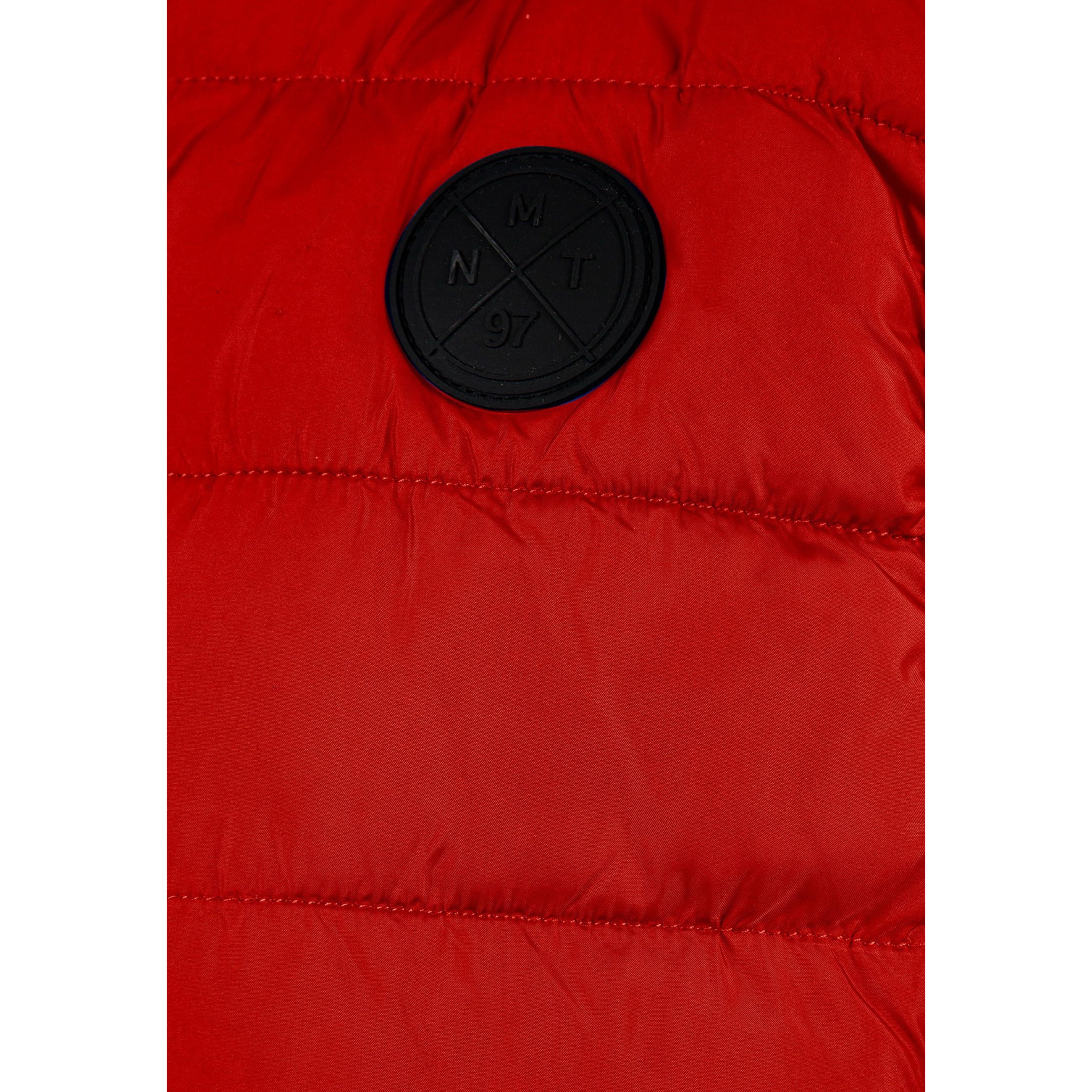 Close-up detail of red padded gilet showing quilted texture, zip fastener and gathered hood construction