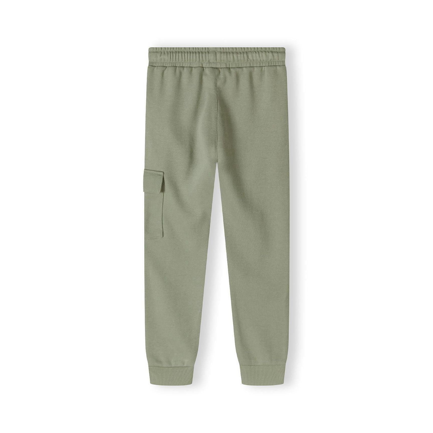 Close-up of olive green fleece joggers showing drawstring waist detail and orange logo patch on leg