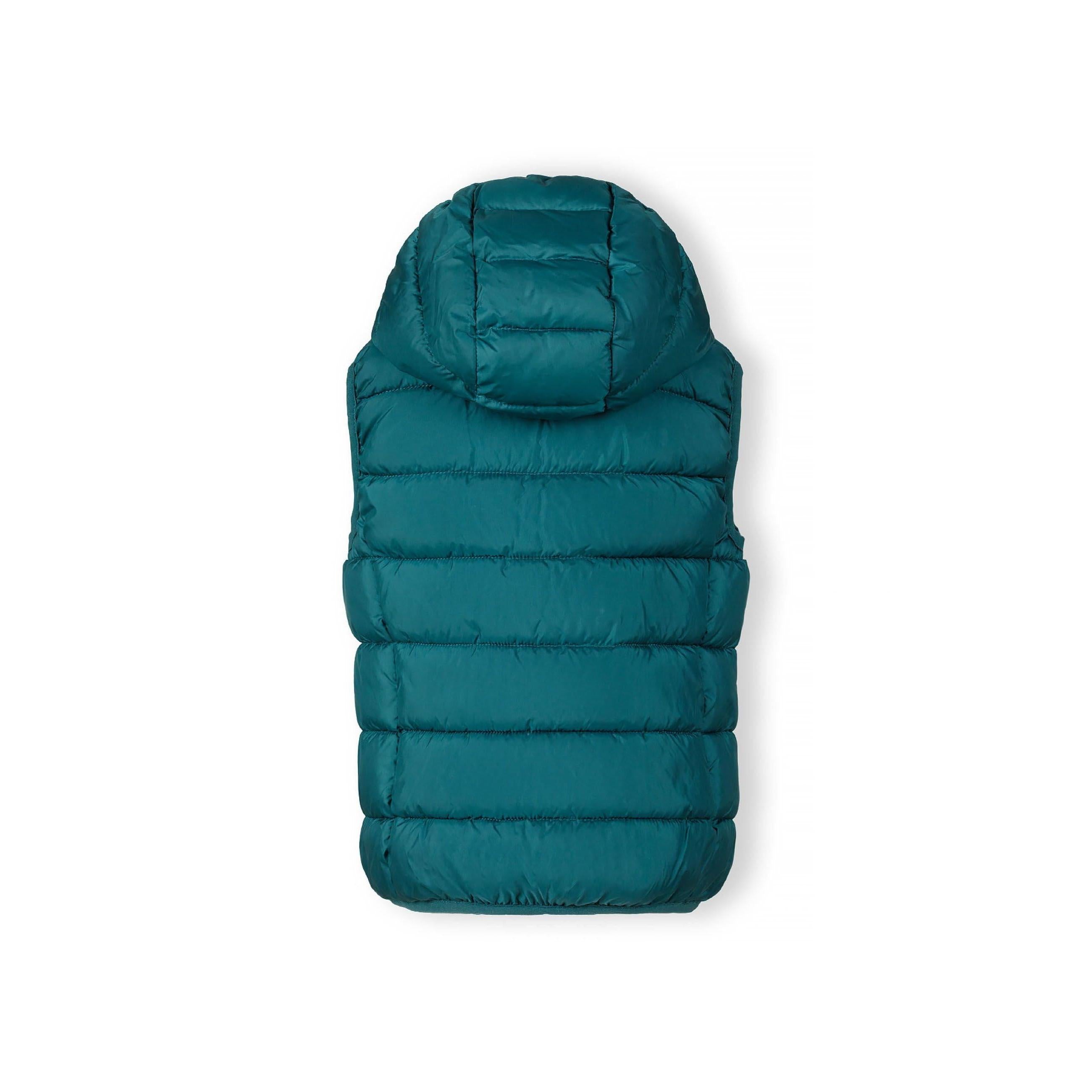 Close-up detail of green quilted fabric showing padded construction and stitching pattern in teal green shade
