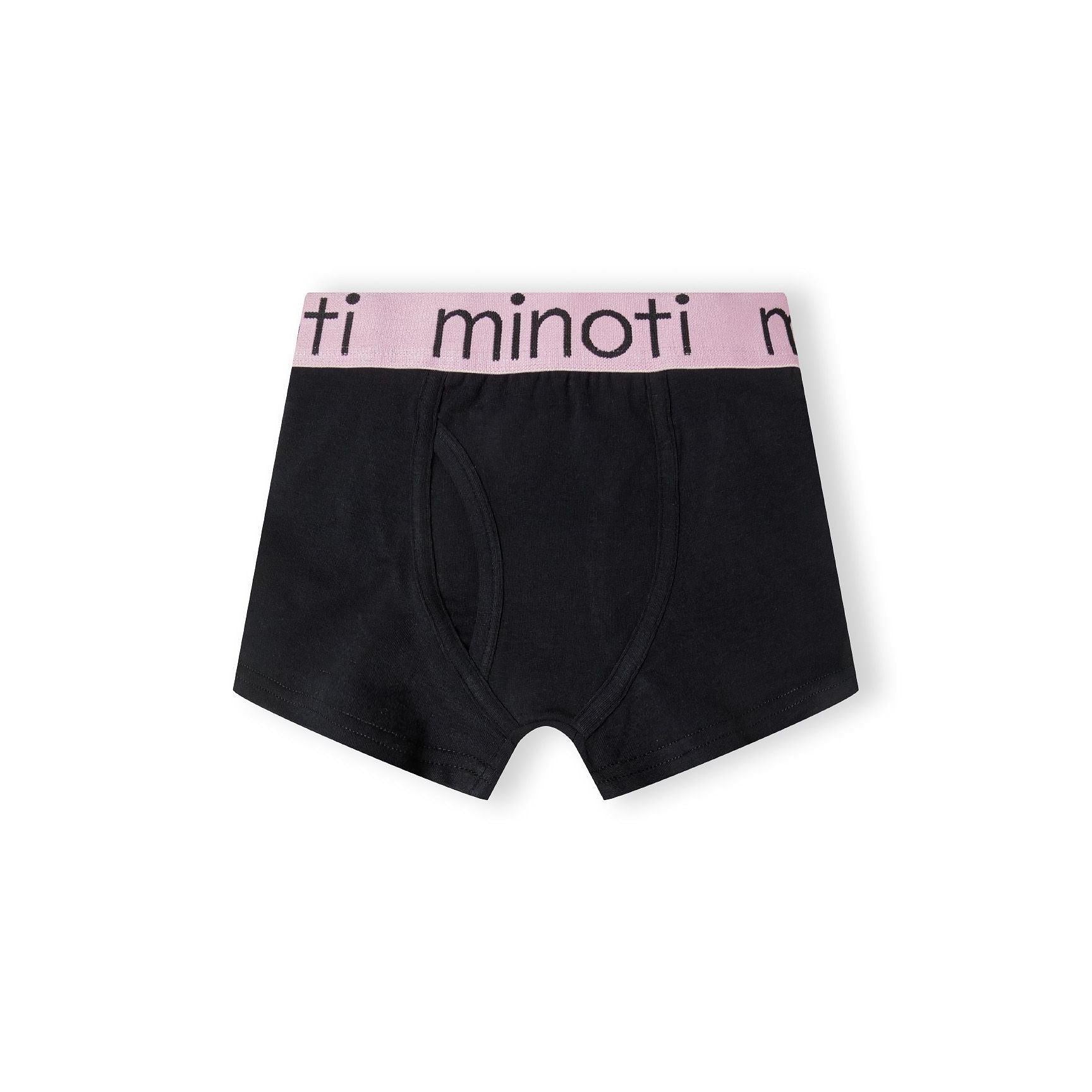Single black trunk with pink waistband featuring Minoti branding, displayed flat against white background showing classic cut and construction