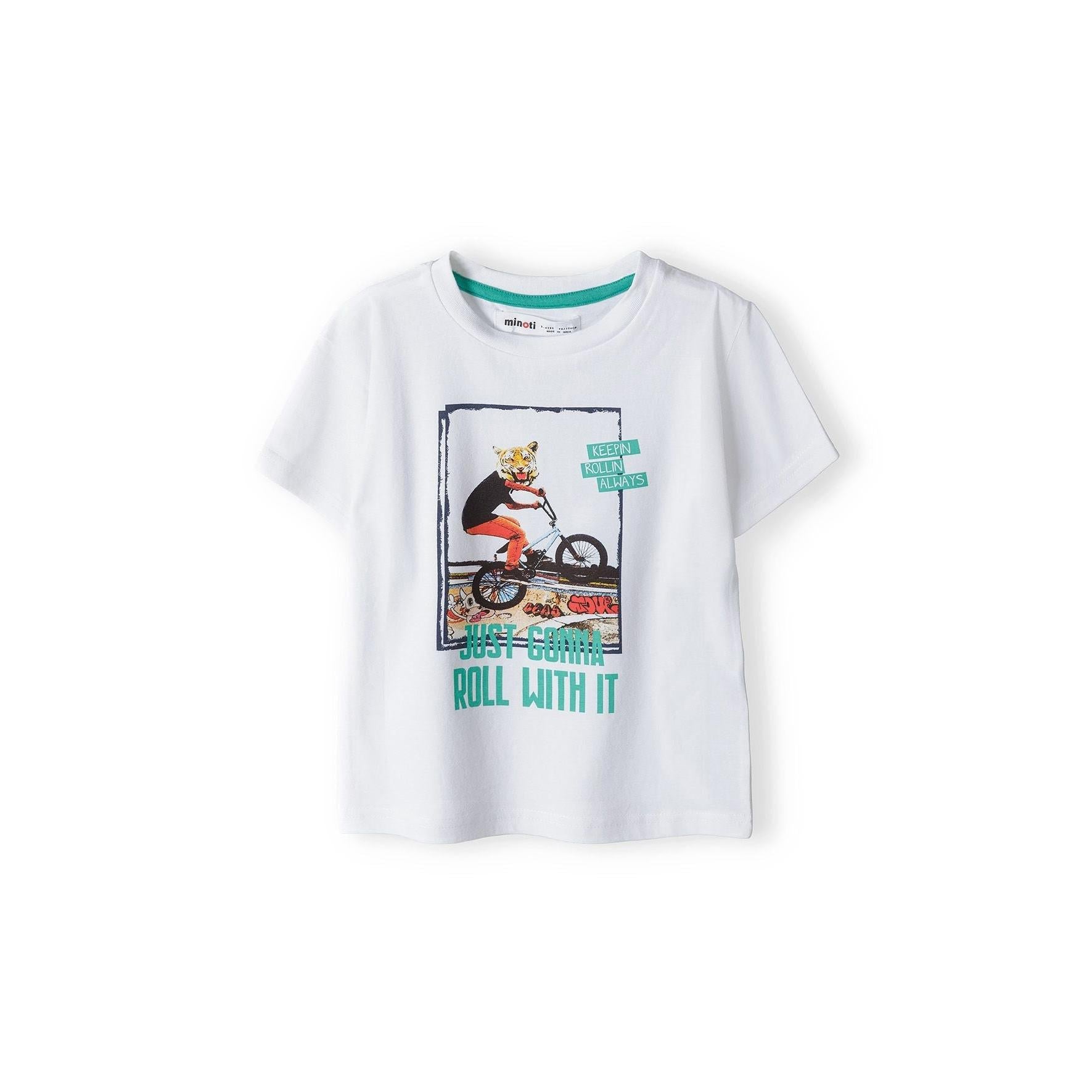 White short sleeve t-shirt with tiger on BMX bike graphic print, displayed flat against white background, showing front view with adventure-themed design