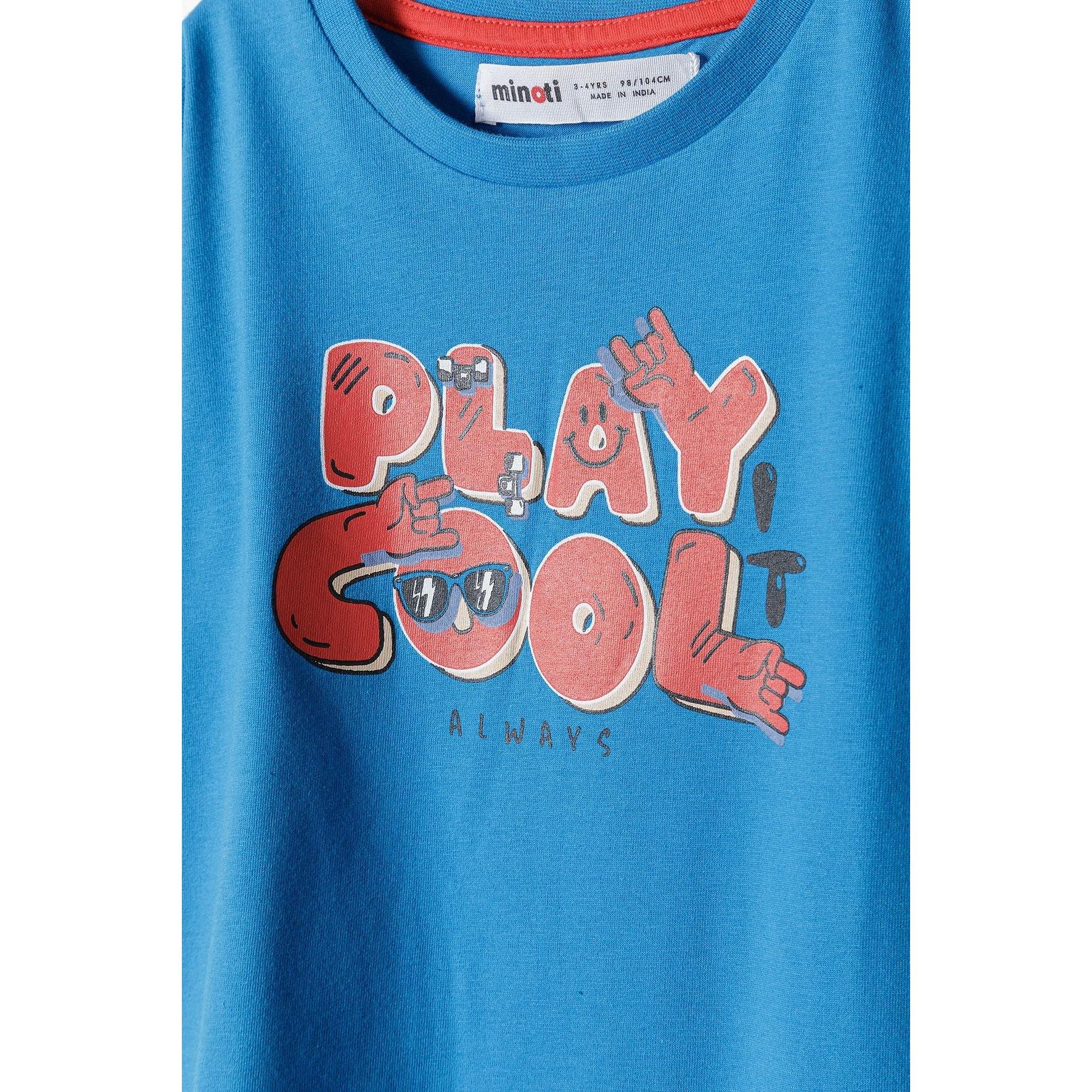 Close-up detail of Play Cool graphic print with red lettering and character designs, showing Minoti label at neckline