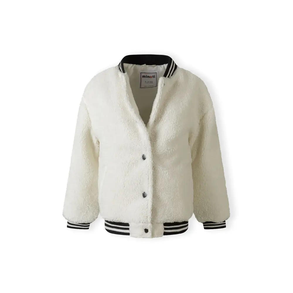 Close-up detail of cream borg fabric texture showing side pocket with ribbed hem trim in navy and white stripes