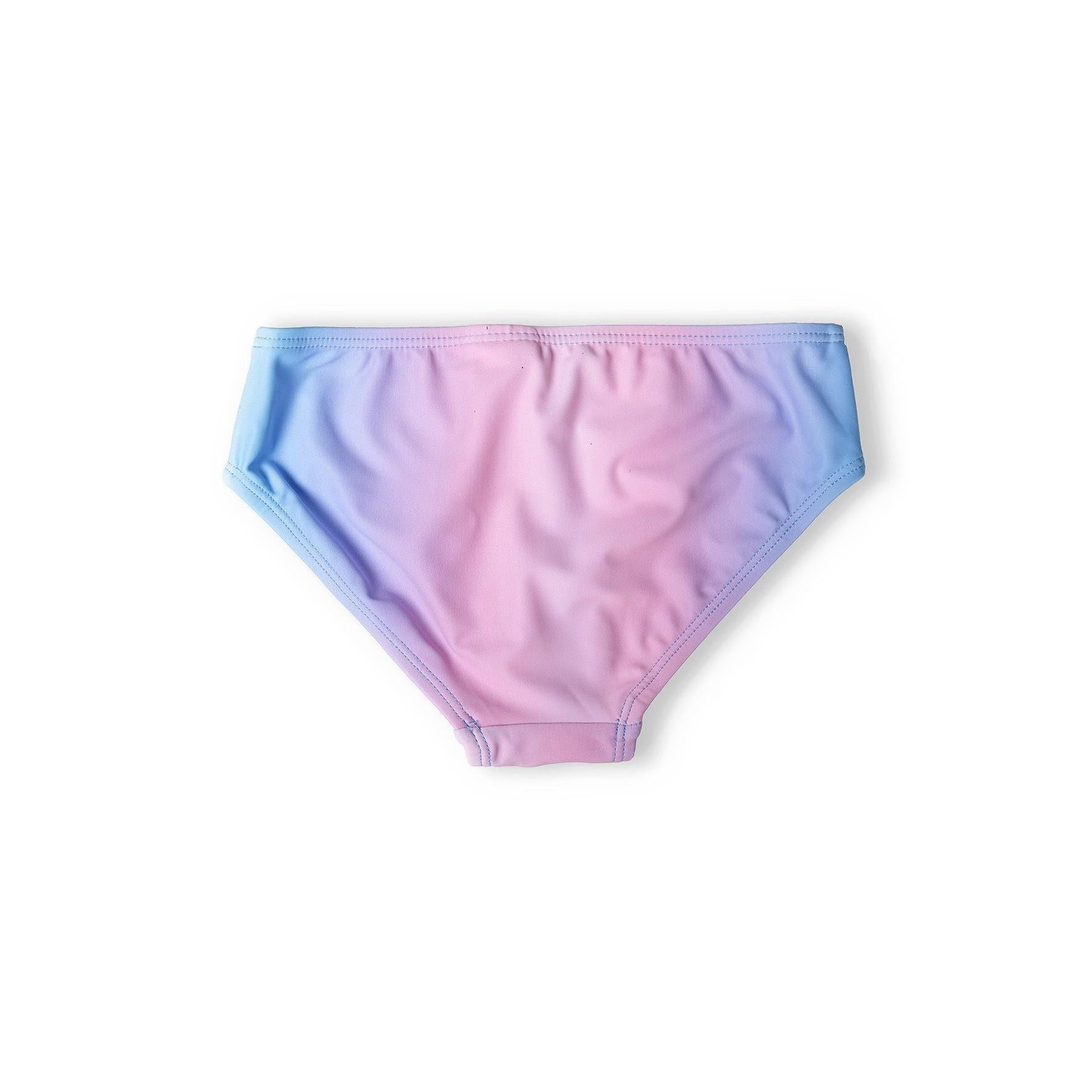 Close-up of bikini briefs showing blue to pink gradient fade pattern laid flat on white background
