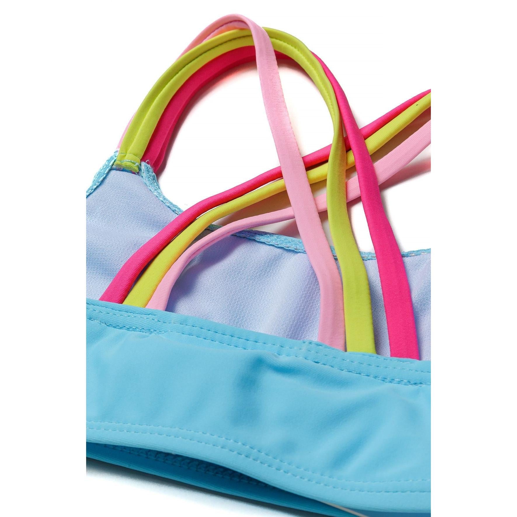 Close-up detail of rainbow coloured elastic straps crossing over turquoise bikini fabric, showing construction and colour variety