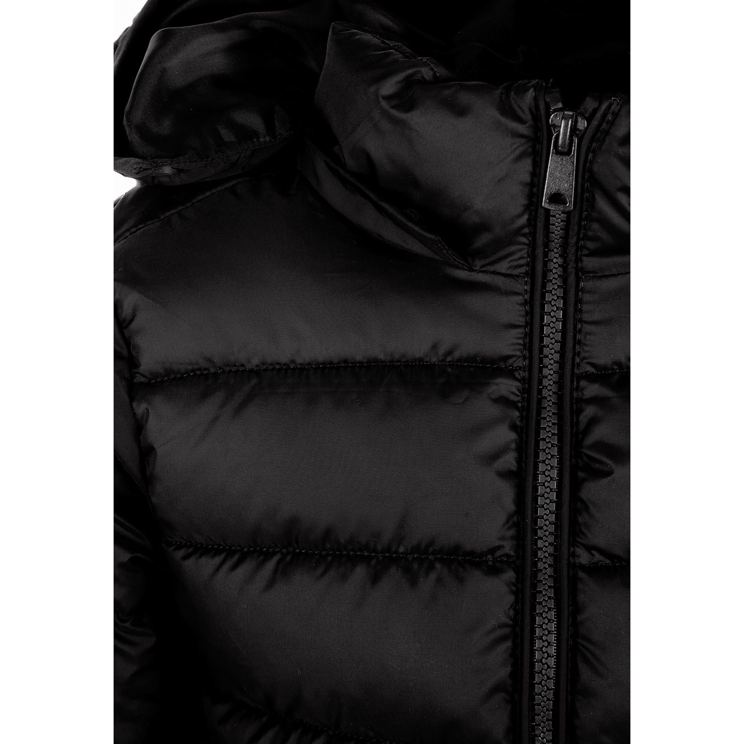 Close-up detail of black quilted fabric texture with zip fastening and hood construction