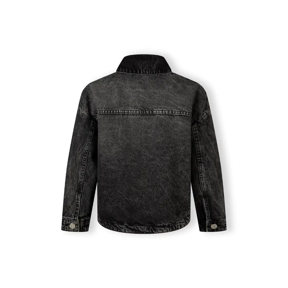 Back view of black acid wash denim jacket showing oversized fit and classic denim construction details on white background