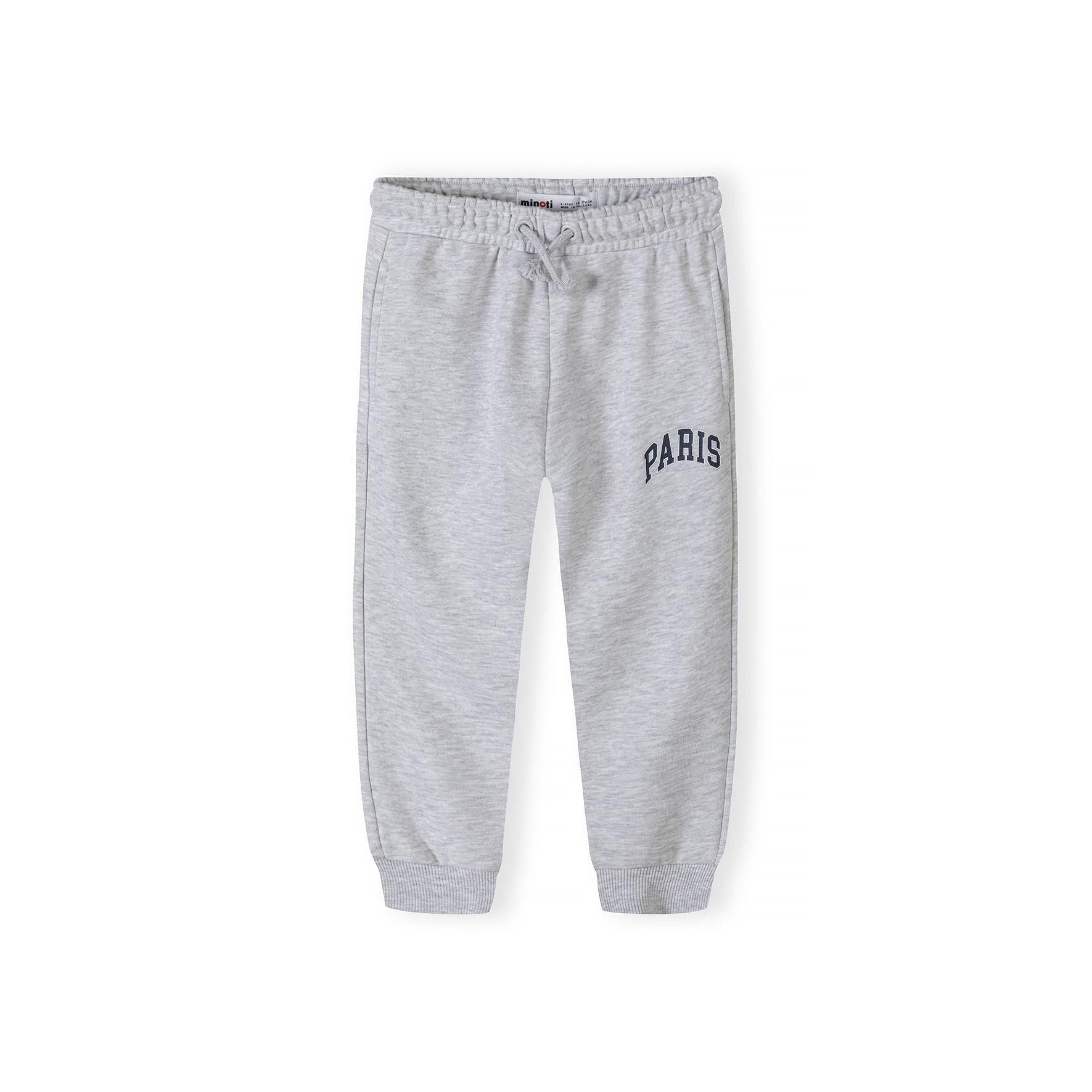 Grey fleece joggers with Paris print on white background, front view showing elasticated waistband with drawstring and ribbed ankle cuffs
