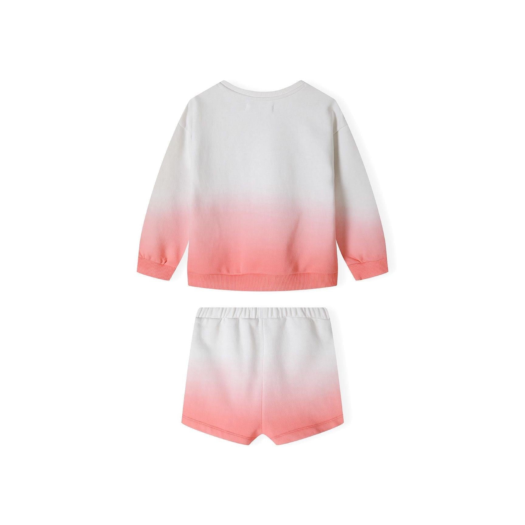 Close-up detail of sparkly gold SUNSHINE lettering on coral gradient fleece sweatshirt showing texture and Minoti label