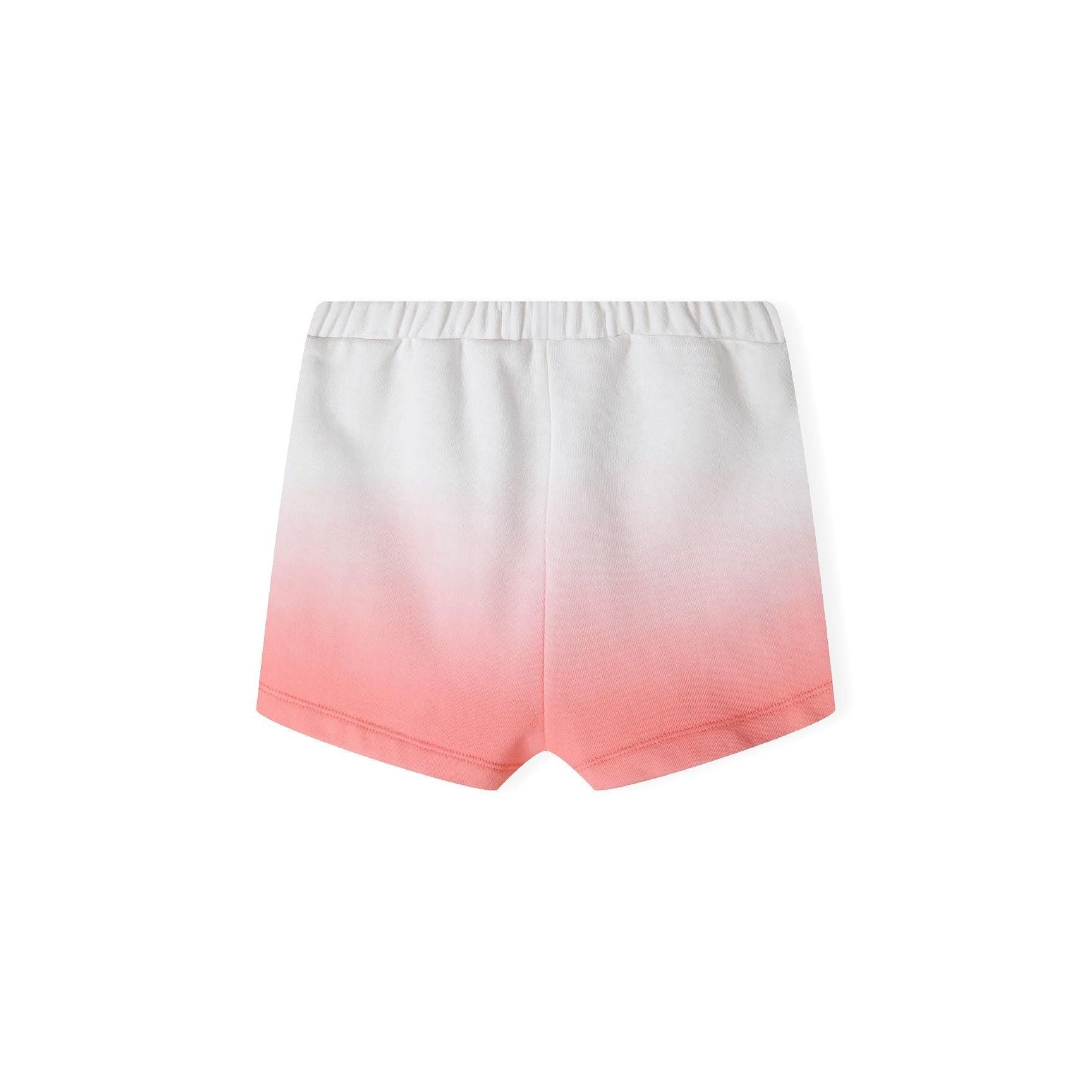 Close-up detail of sparkly gold SUNSHINE lettering on coral gradient fleece sweatshirt showing texture and Minoti label