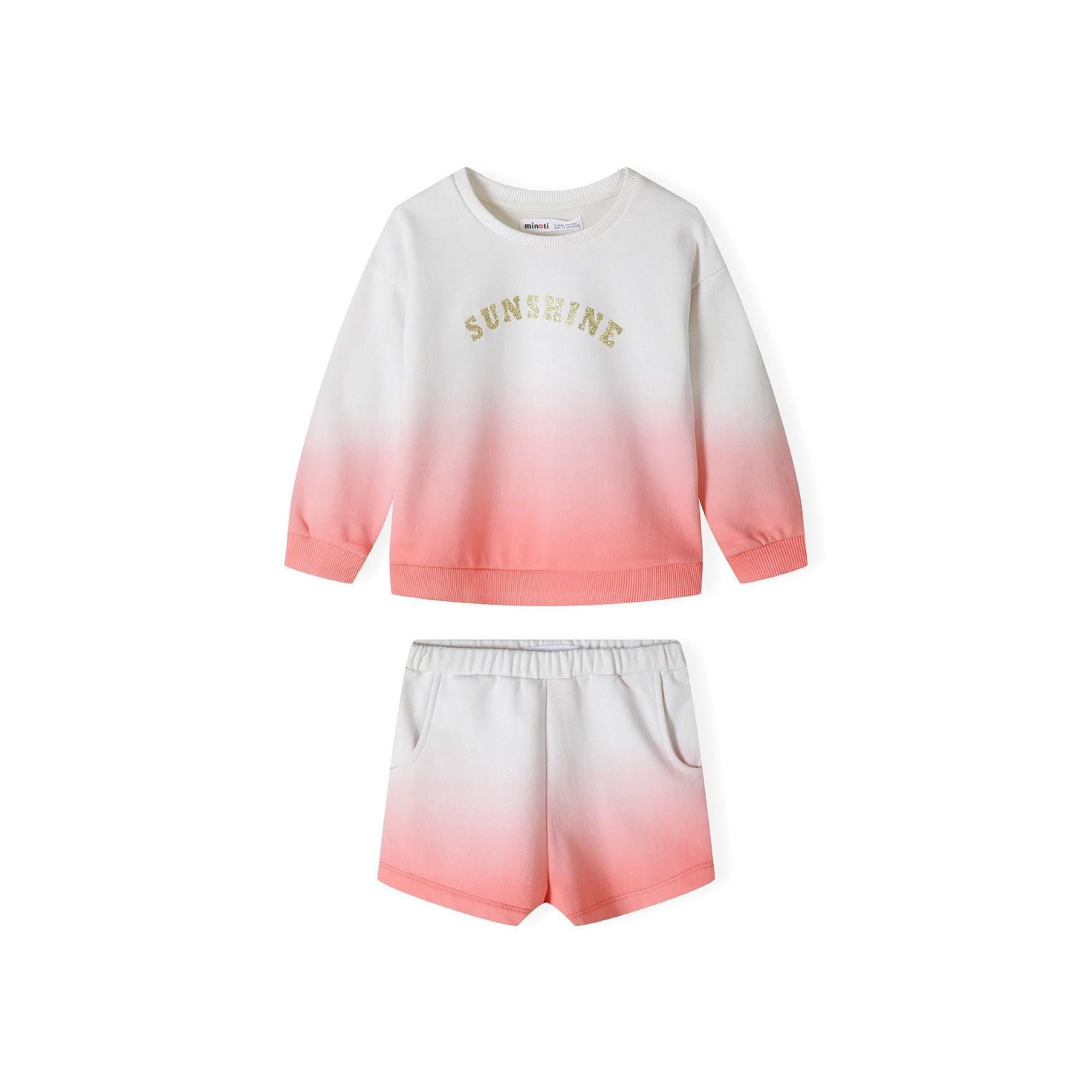 Back view of coral gradient fleece sweatshirt showing smooth ombre transition from cream to coral pink with ribbed cuffs