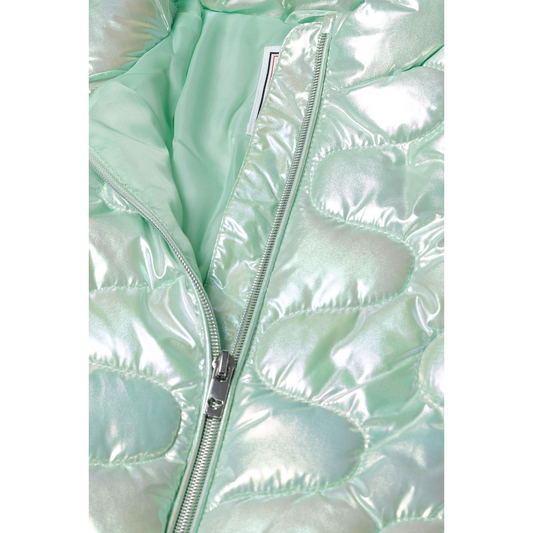 Close-up detail of mint green quilted jacket showing zip closure, quilted texture and sleeve construction