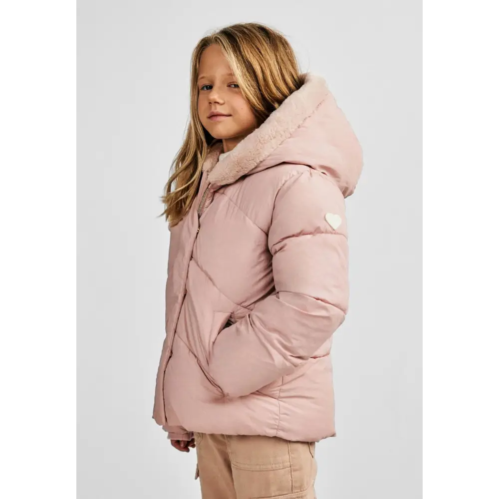 Side profile view of girl in pink hooded padded jacket showing quilted texture and hood detail with faux fur lining