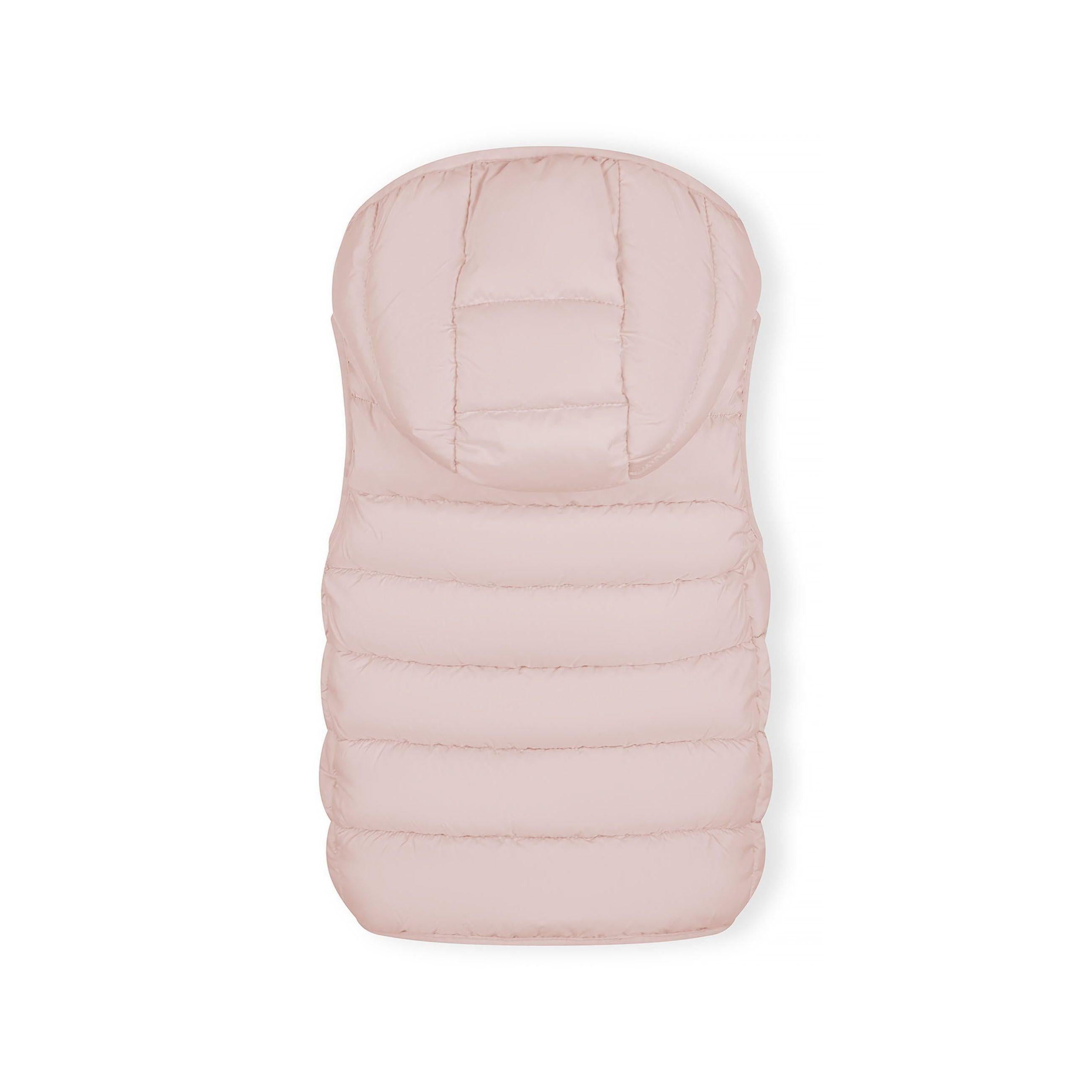 Close-up detail of pink quilted fabric showing stitched panels and clear branded patch with pink Minoti logo at bottom hem