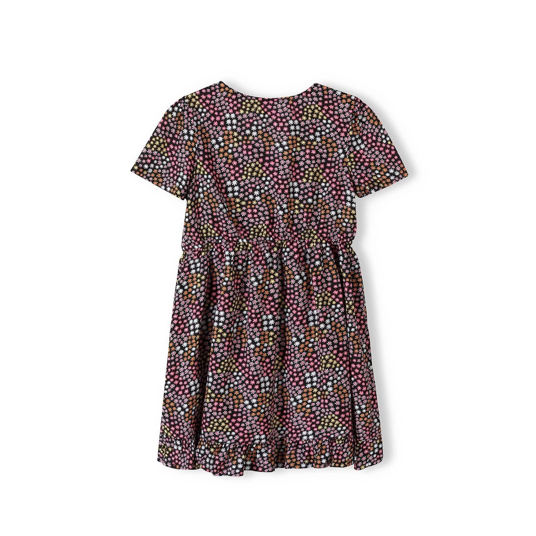 Multicoloured star print wrap dress laid flat showing short sleeves, wrap front detail and gathered skirt with frill hem on white background