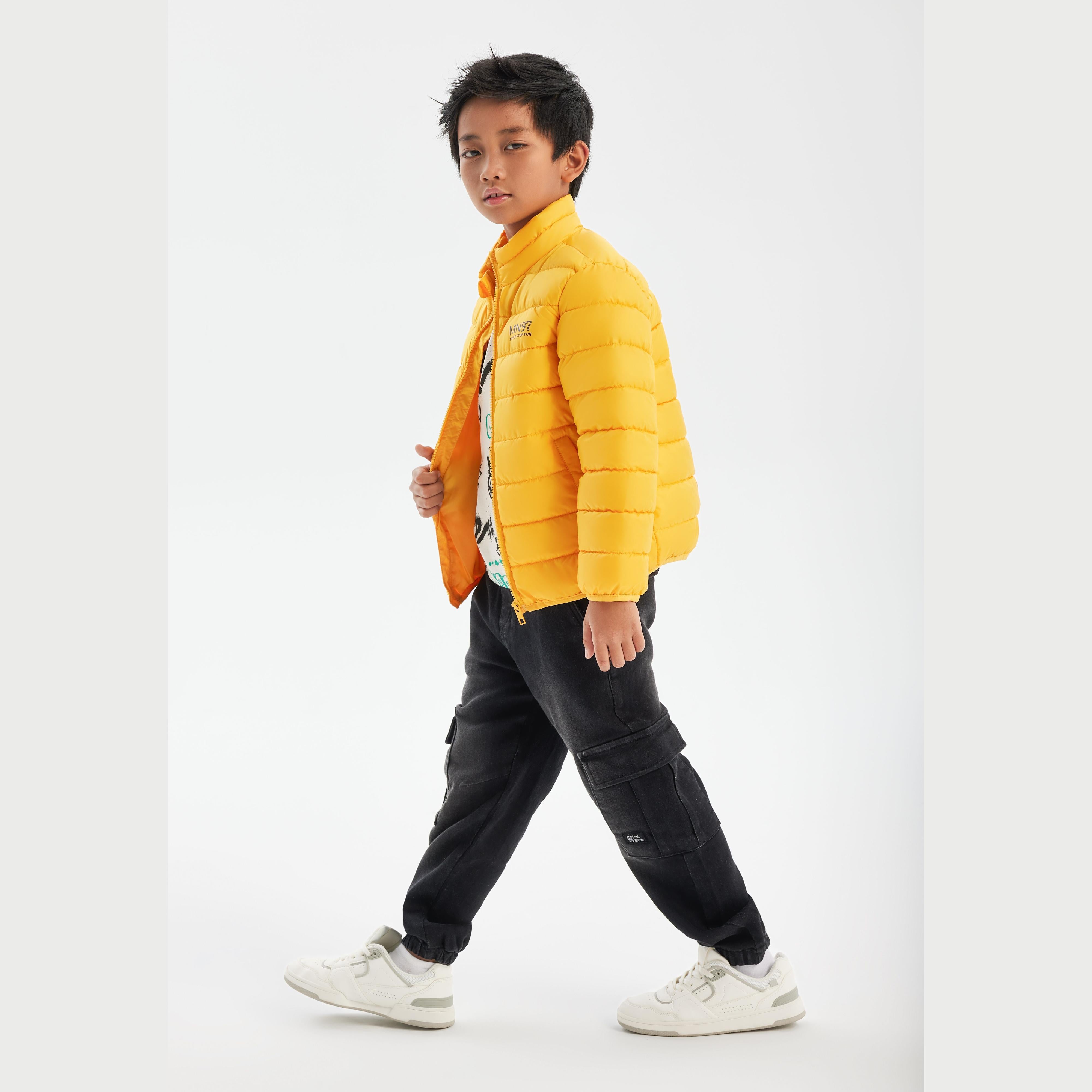 Back view of bright yellow quilted jacket showing horizontal padded panels and ribbed collar detail on white background