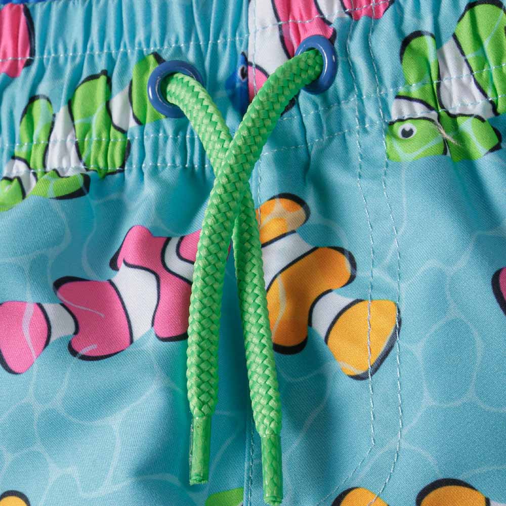 Turquoise board shorts detail with colourful clownfish print featuring green drawstrings.