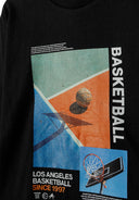 Graphic print of a basketball theme on a black long sleeve shirt for boys 2-14y. Unique design featuring Los Angeles Basketball since 1997.