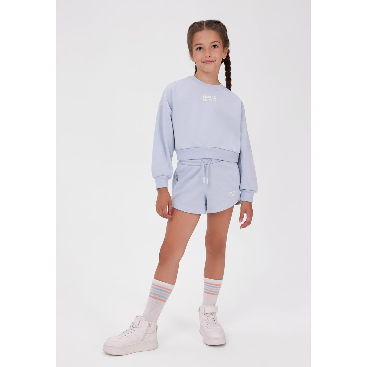 Girls' sweatshirt and shorts set in light blue — complete product view for square Shop card