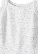 Close-up of a textured white sleeveless top