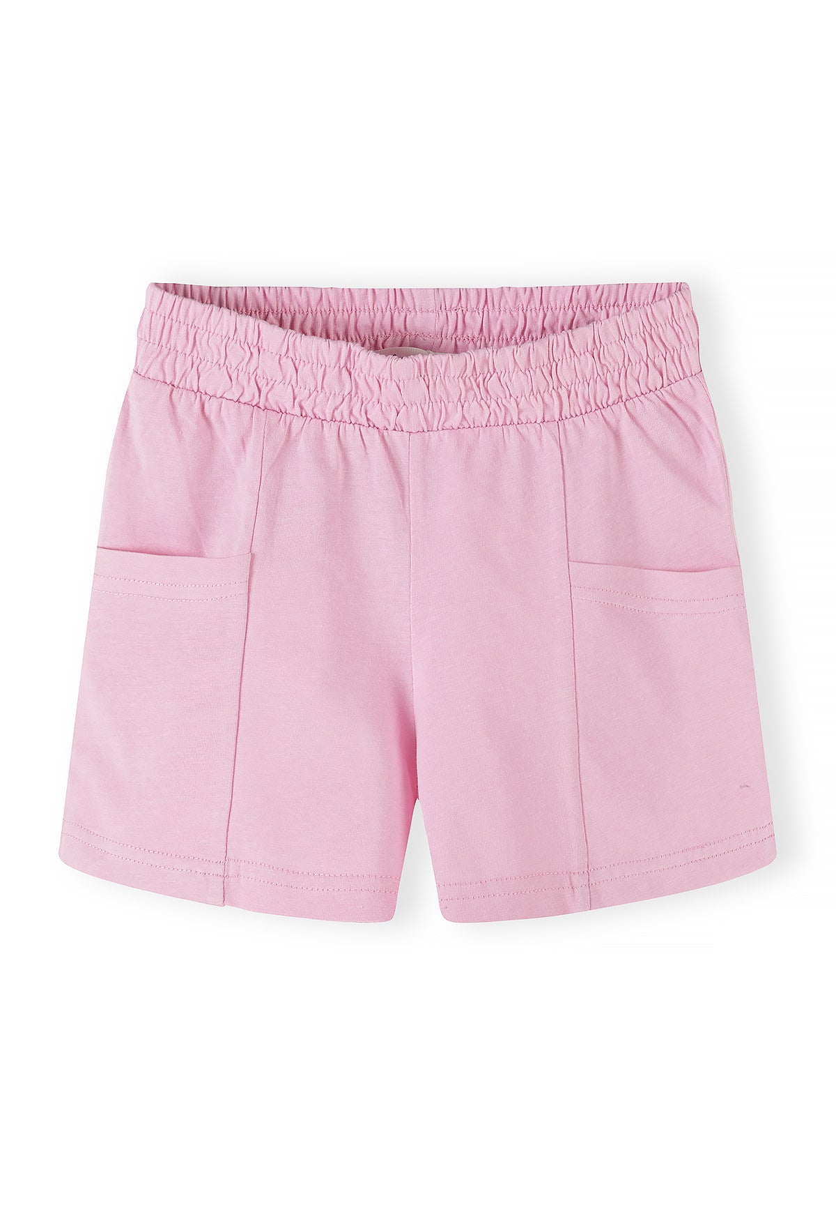 Close-up of multicolour rainbow print jersey shorts showing hearts, rainbows, leopard spots and flowers pattern with elastic waistband on white background