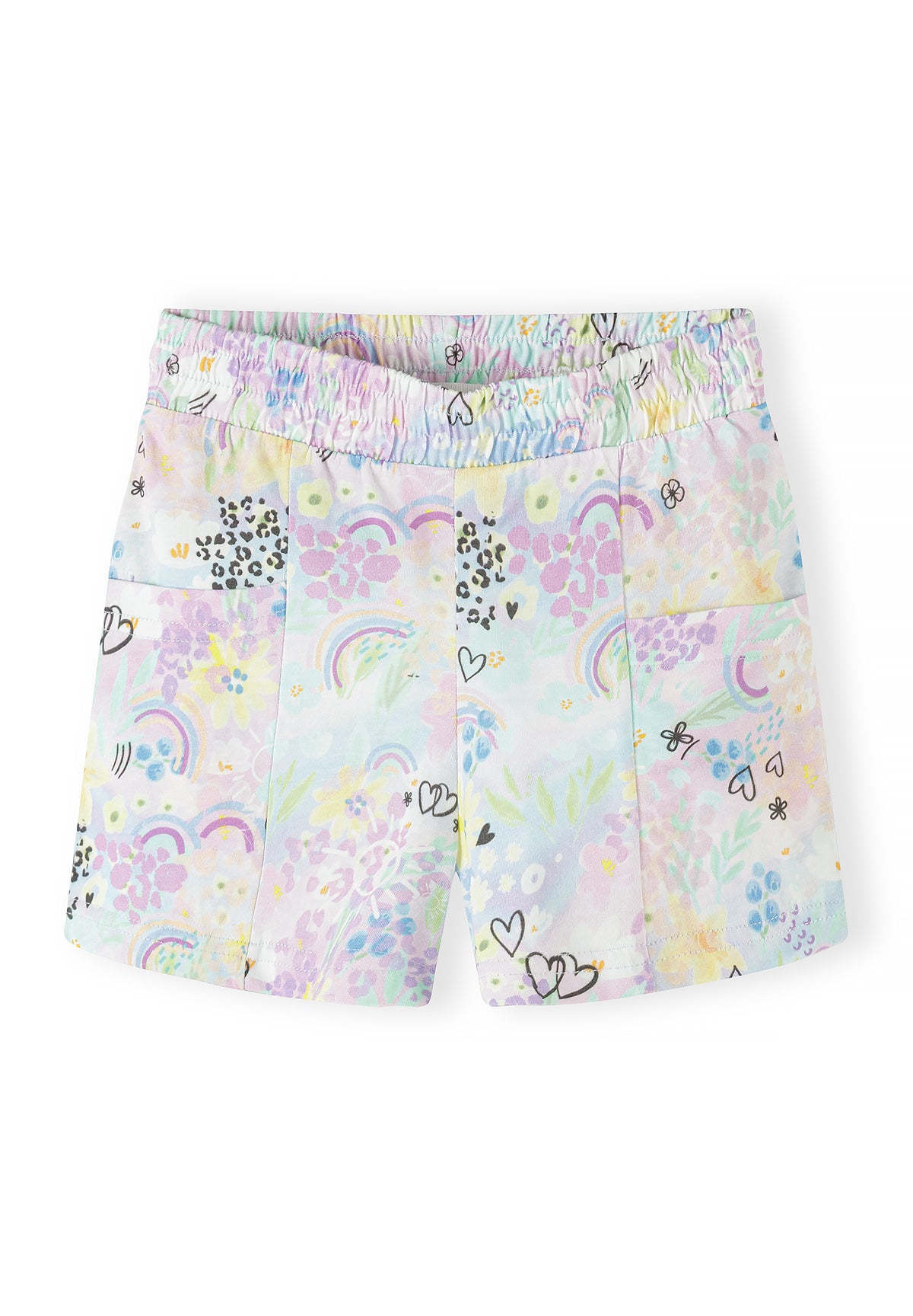 Close-up of multicolour rainbow print jersey shorts showing hearts, rainbows, leopard spots and flowers pattern with elastic waistband on white background