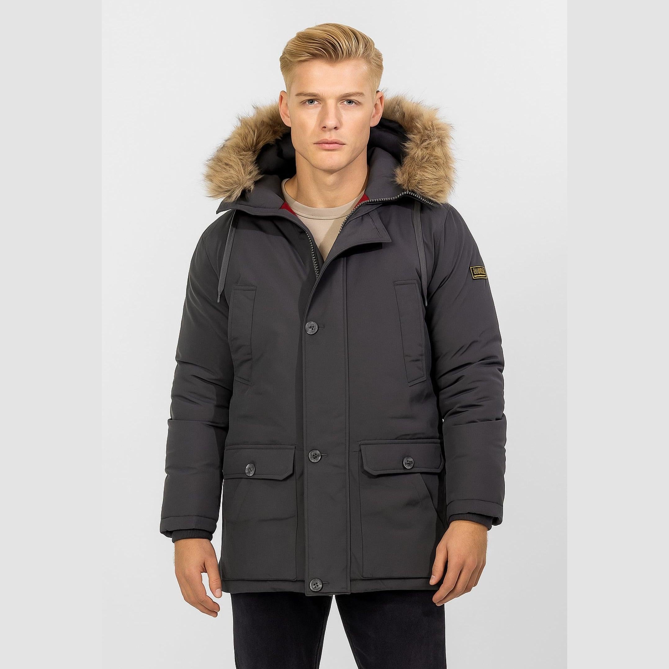 Men's dark grey winter parka jacket with a faux fur-trimmed hood, button and zip fastening, and front pockets.
