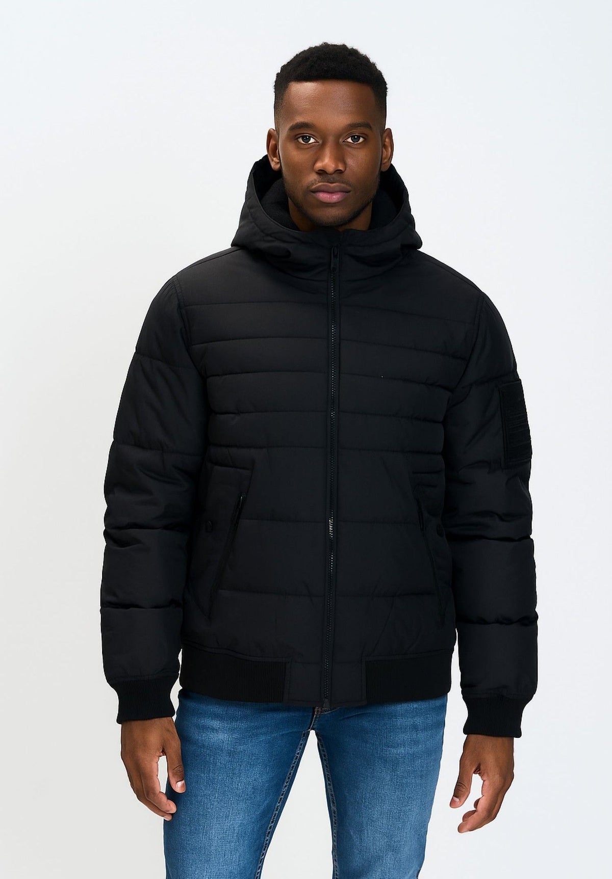 Men's black puffer jacket, shown worn.