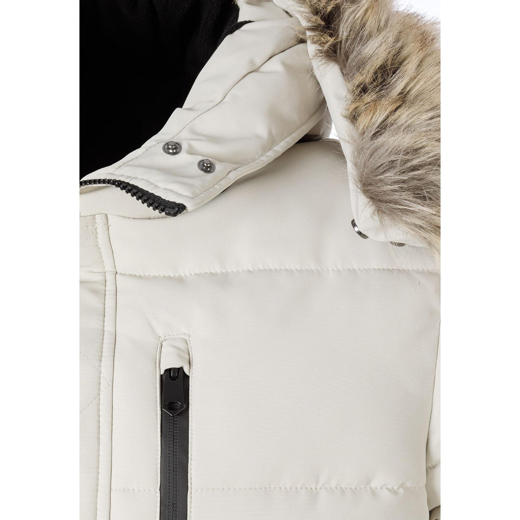 Close-up detail of grey padded jacket showing chest zip pocket, quilted texture and faux fur hood trim